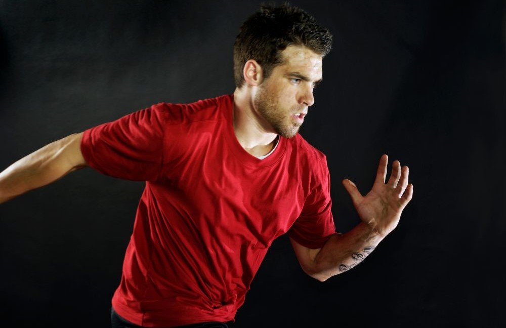 Image of a focused guy sprinting