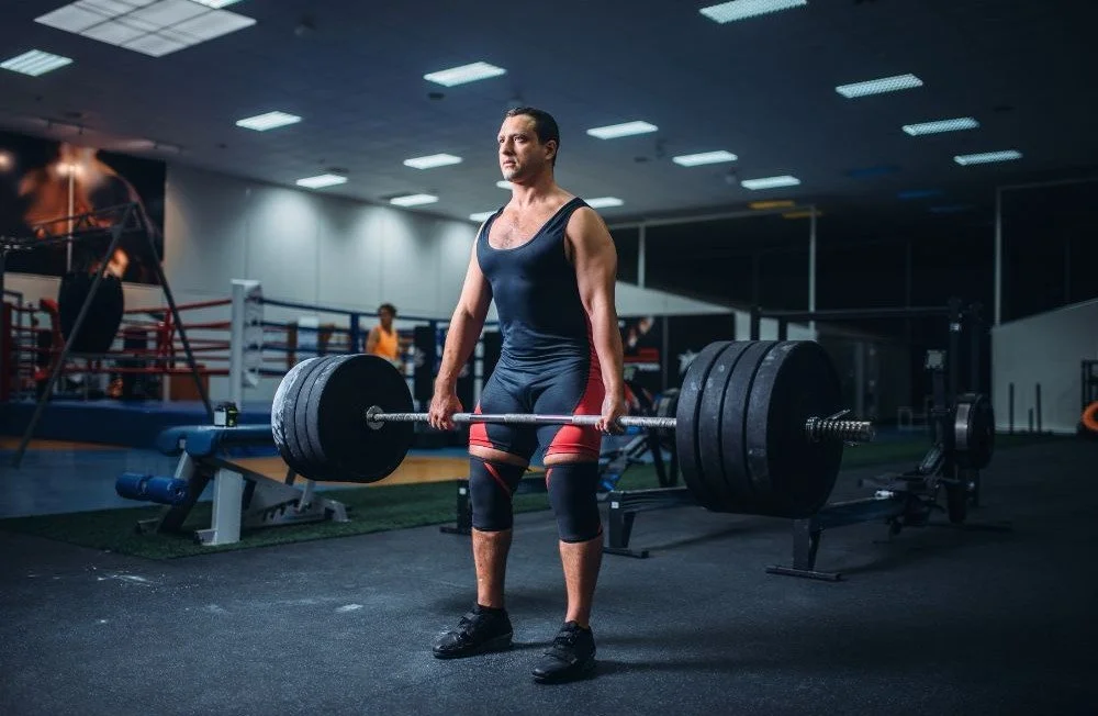 Image of a strong man deadlifting a weight