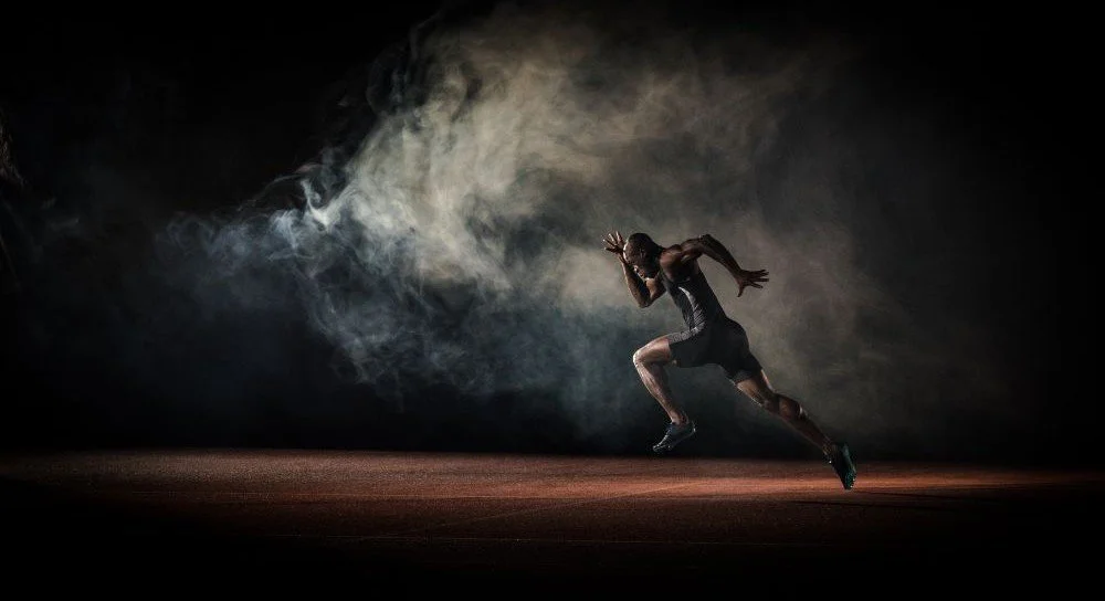 Image of a guy sprinting down a track