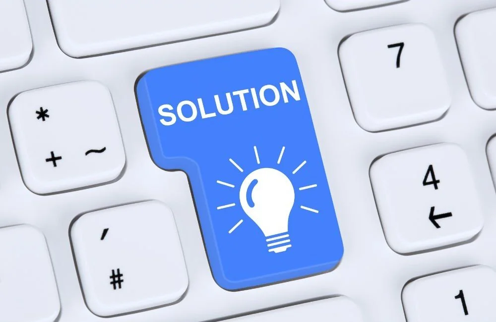 A keyboard with a button that says solution