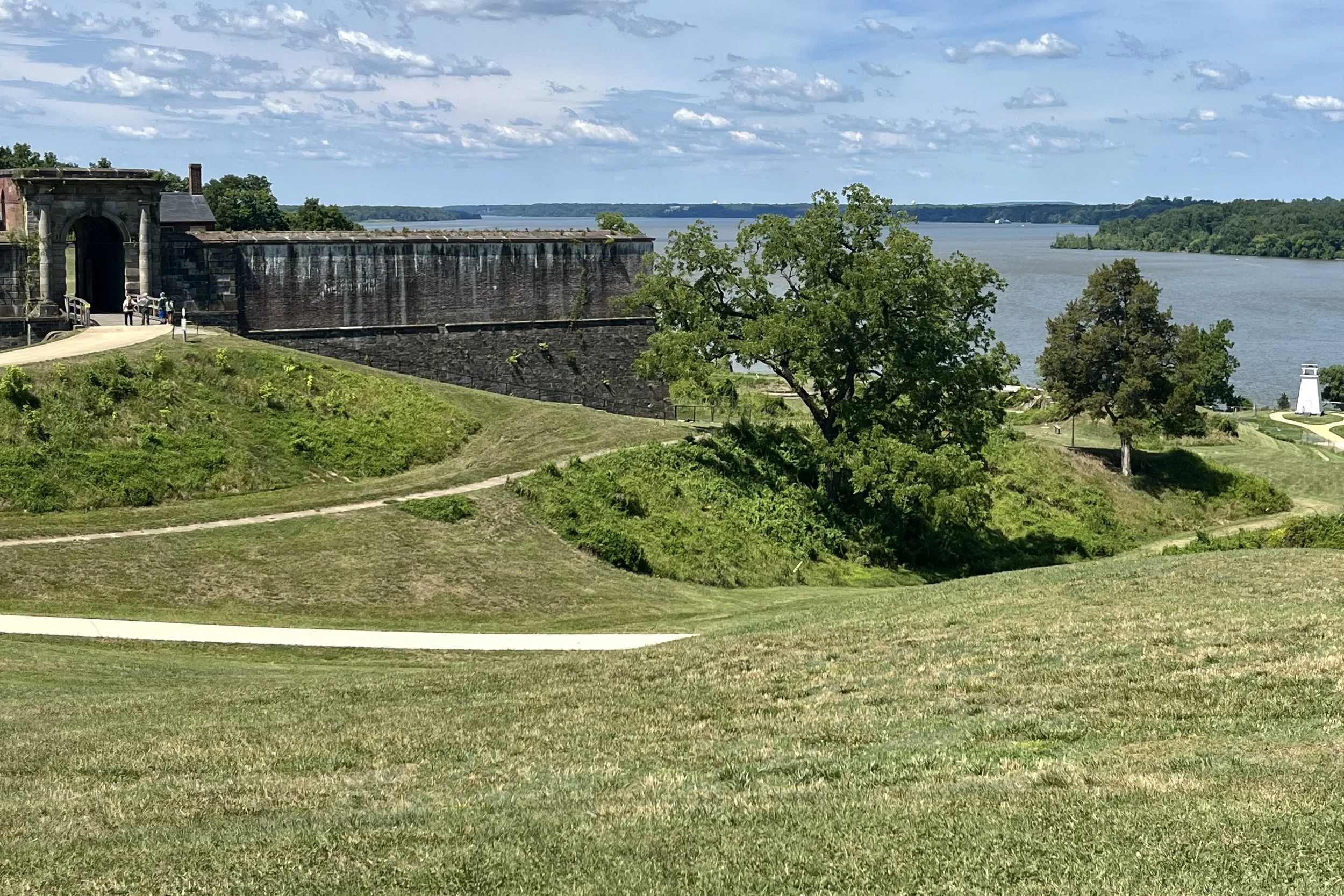 Potomac River view from Fort Washington featuring historic stone walls, open lawns, and waterfront scenery.