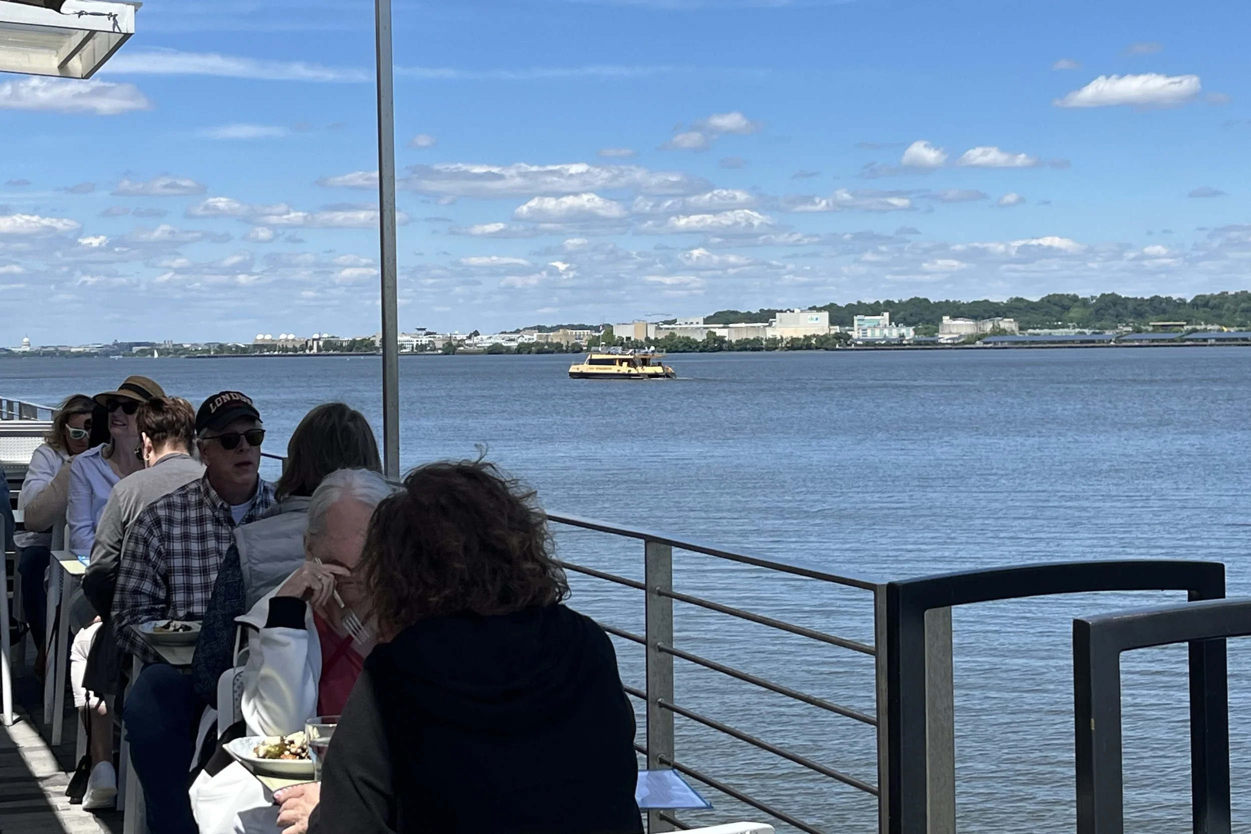 Dog-friendly patio seating at BARCA Pier & Wine Bar in Old Town Alexandria beside the waterfront.