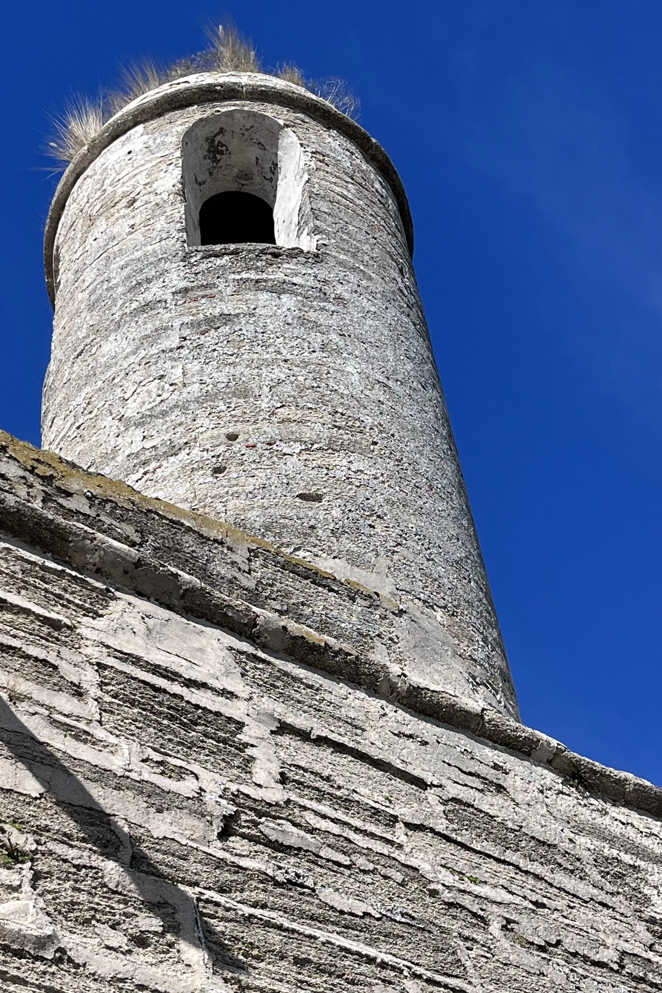 Stone tower detail of Castillo de San Marcos viewed from below