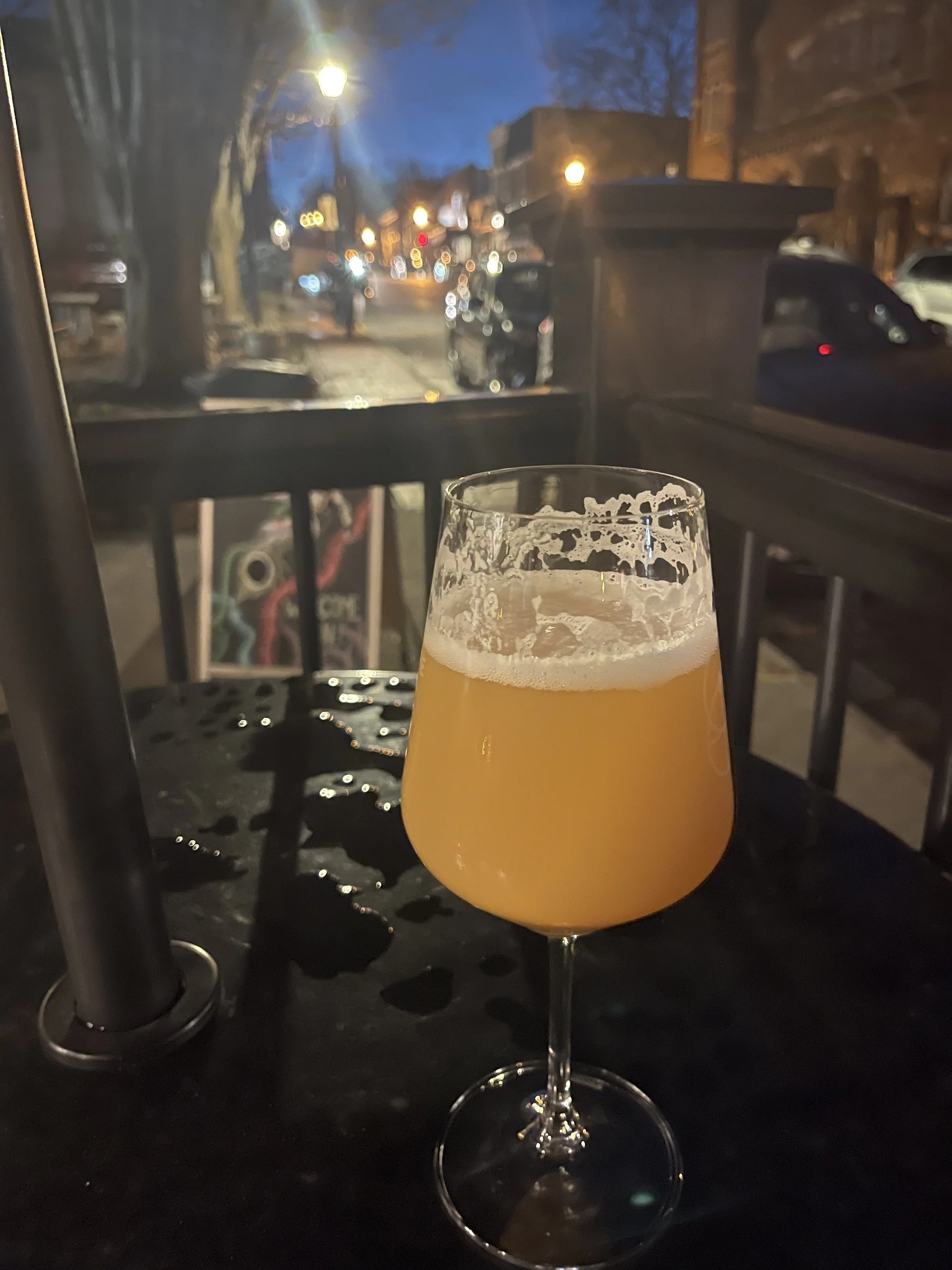 Outdoor deck at Heliotrope Brewery in Lexington, Virginia, with pizza and dogs.