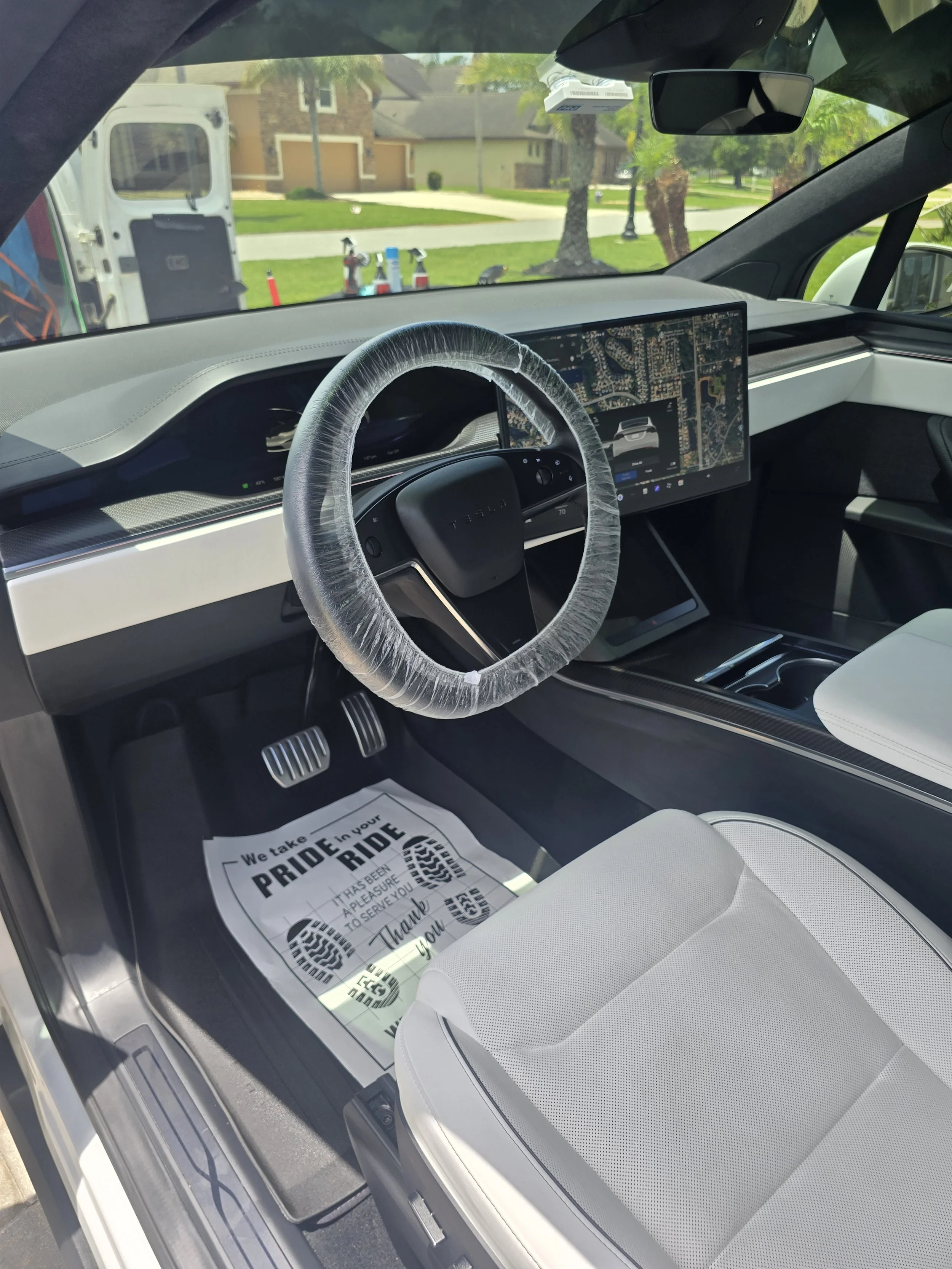 Tesla interior detailing service by R.K. Mobile Detailing – clean steering wheel and dashboard, Palm Coast, Florida