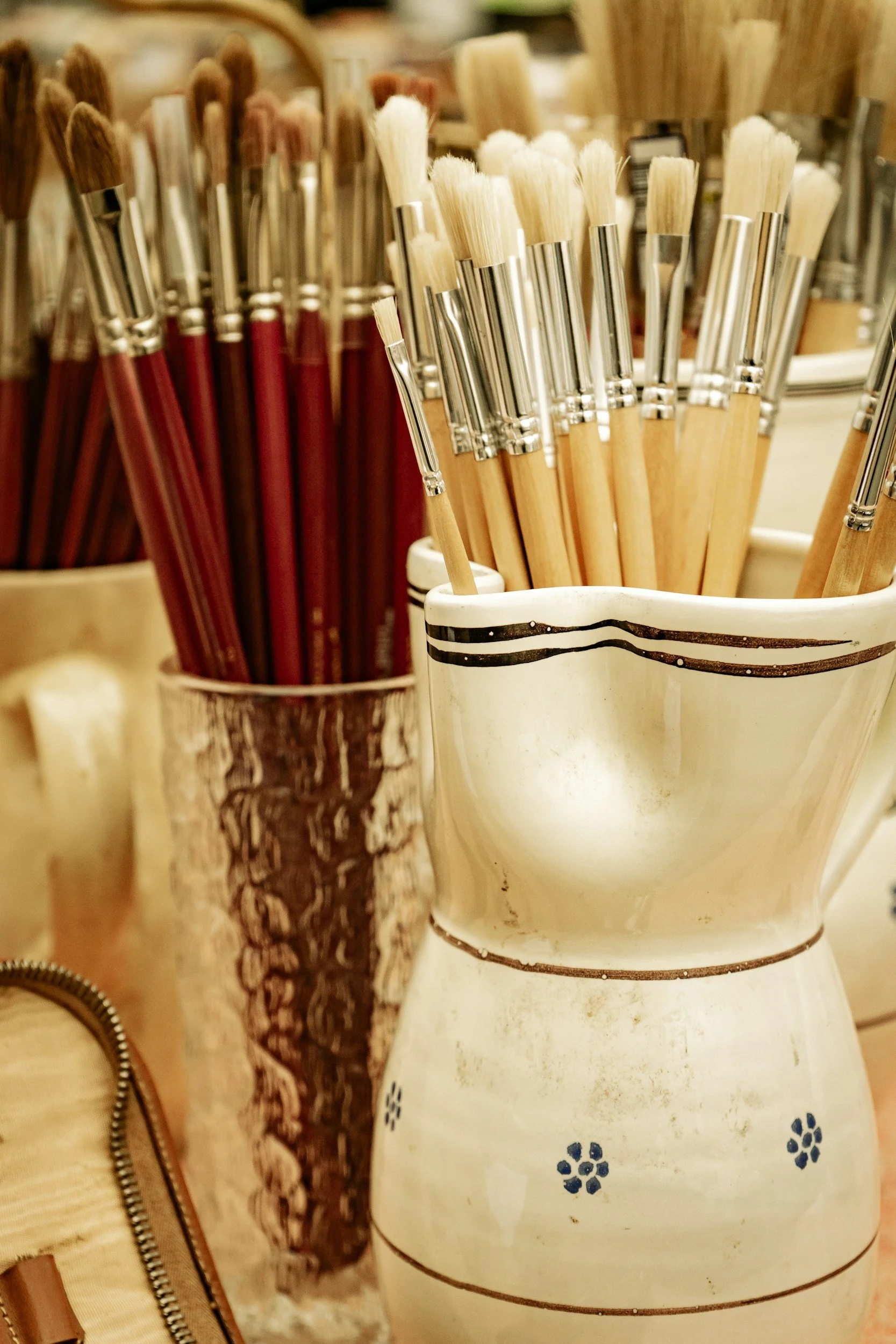 two containers with brushes