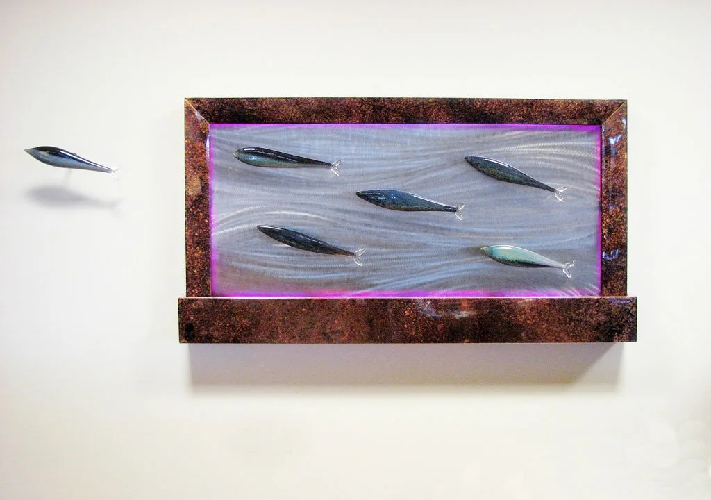 "Fish" water feature. Hand blown glass fish, stainless with fish grind pattern, patinated copper, led lighting. 74"w x 41"h x 7"d
