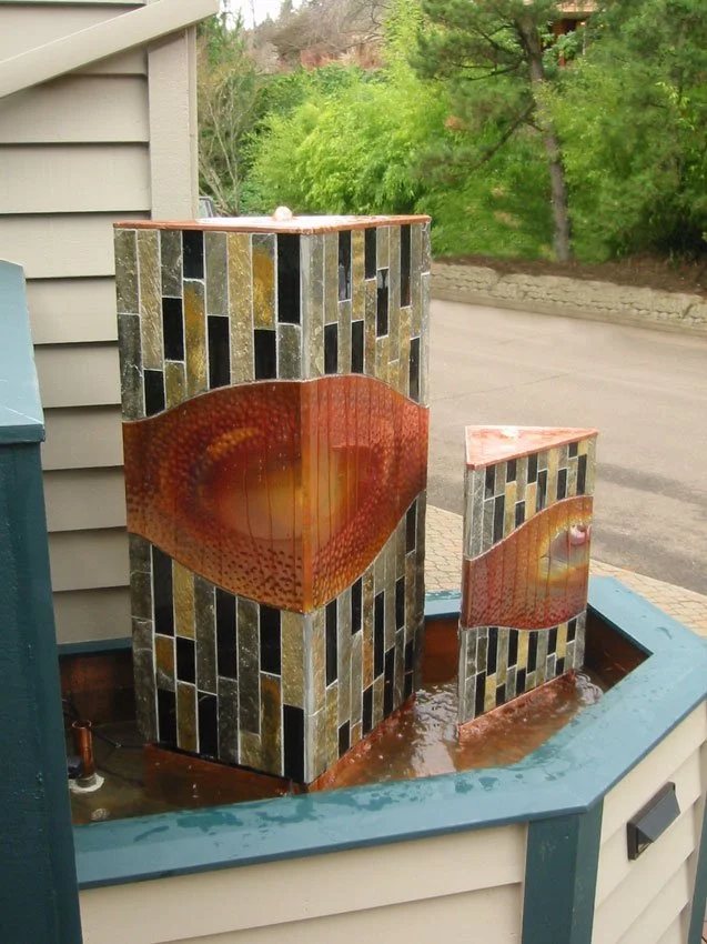 "Trinitarian" water feature. Stone, hammered copper, and kiln fused art glass. 5'h