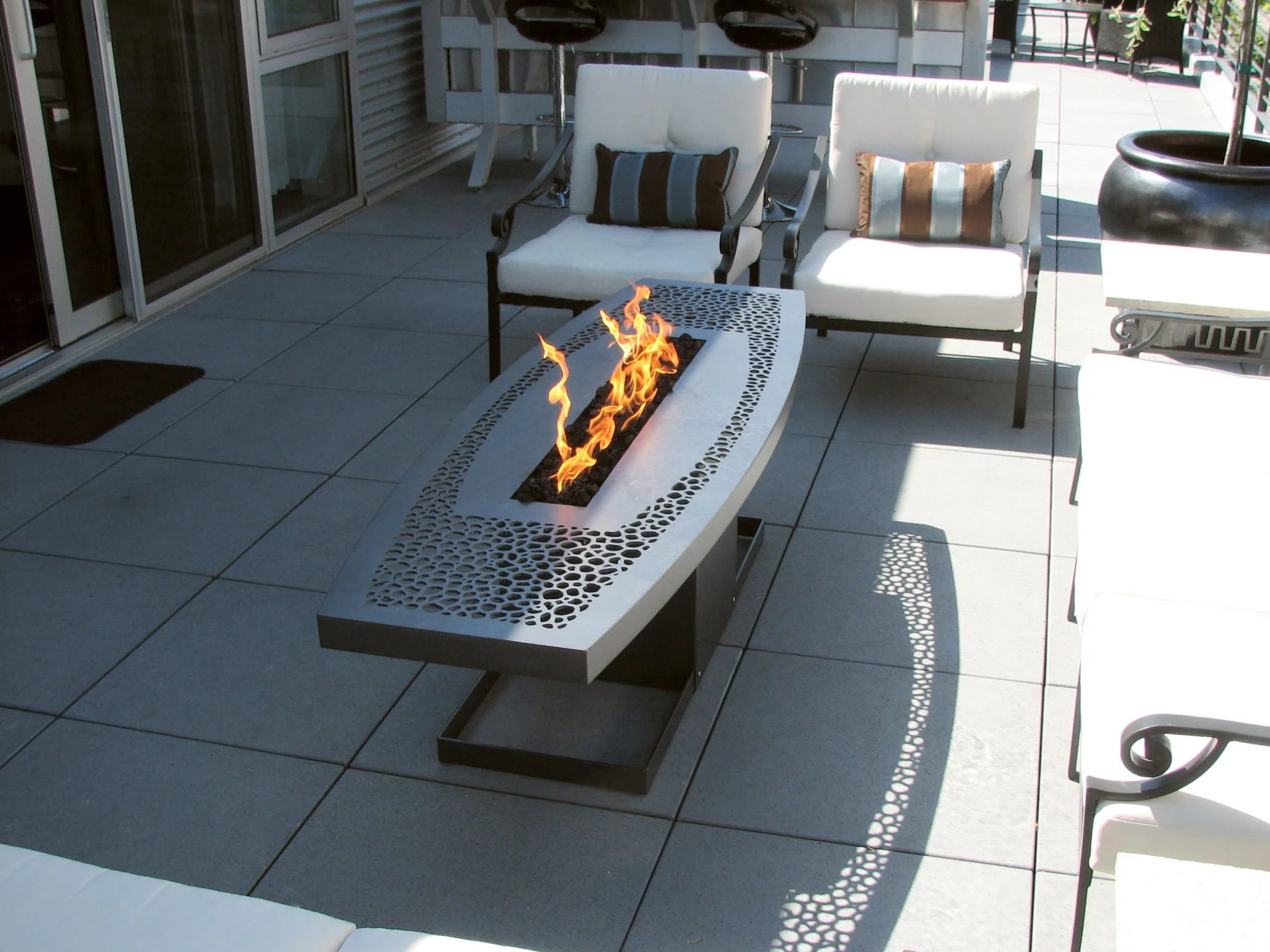 "Savannah" fire table. Laser cut steel with temperature resistant coating. 24"w x 72"l x 21"h propane fueled