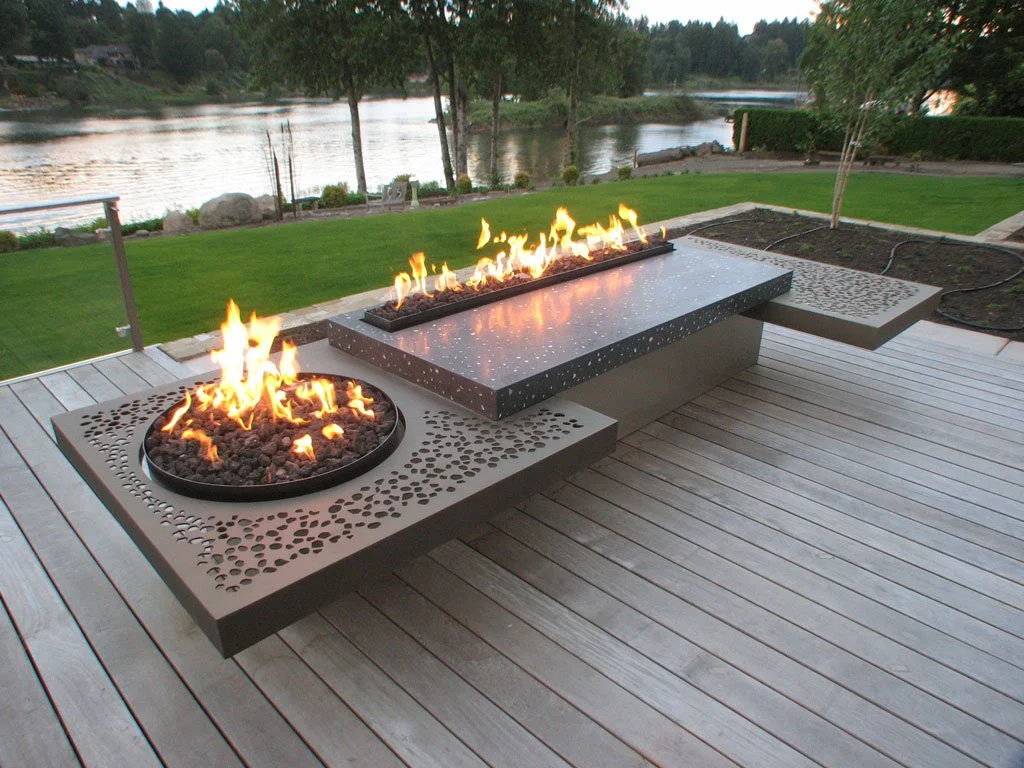 “Incredifire” fire table. 12′ long x 5′ deep. Made from Aluminum, Concrete, and Stainless steel. Separately controlled 6′ linear burner and 2′ round burner. Natural gas fueled