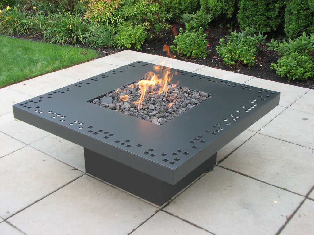Laser cut steel with temperature resistant coating. 48" x 48" x 20" h. Natural gas fueled fire table