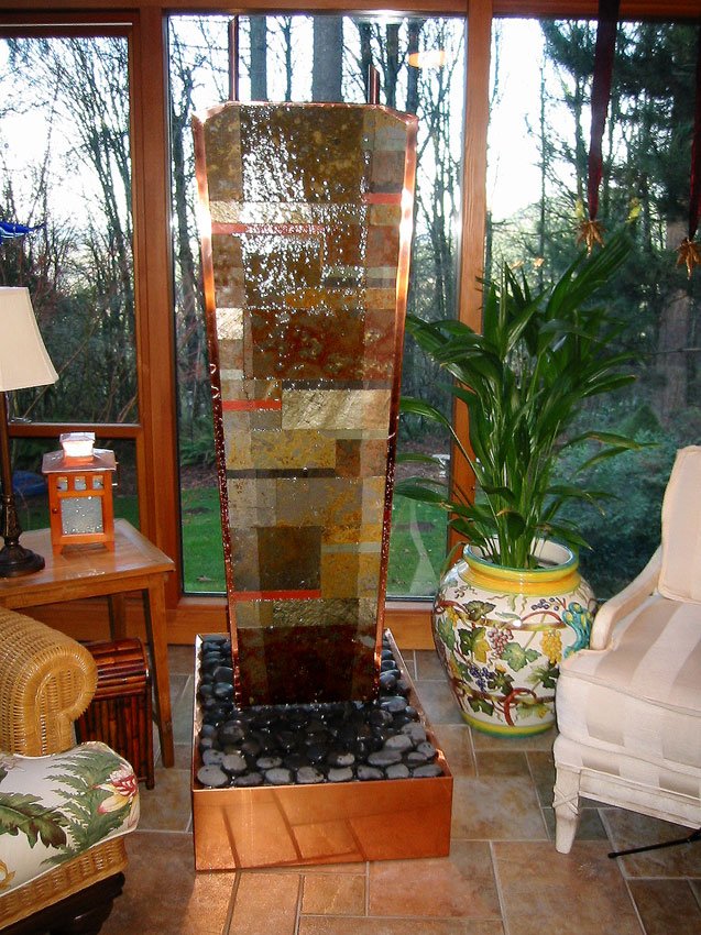 Contemporary stone and copper water feature. Water flows down both sides. 2'w x 6'h