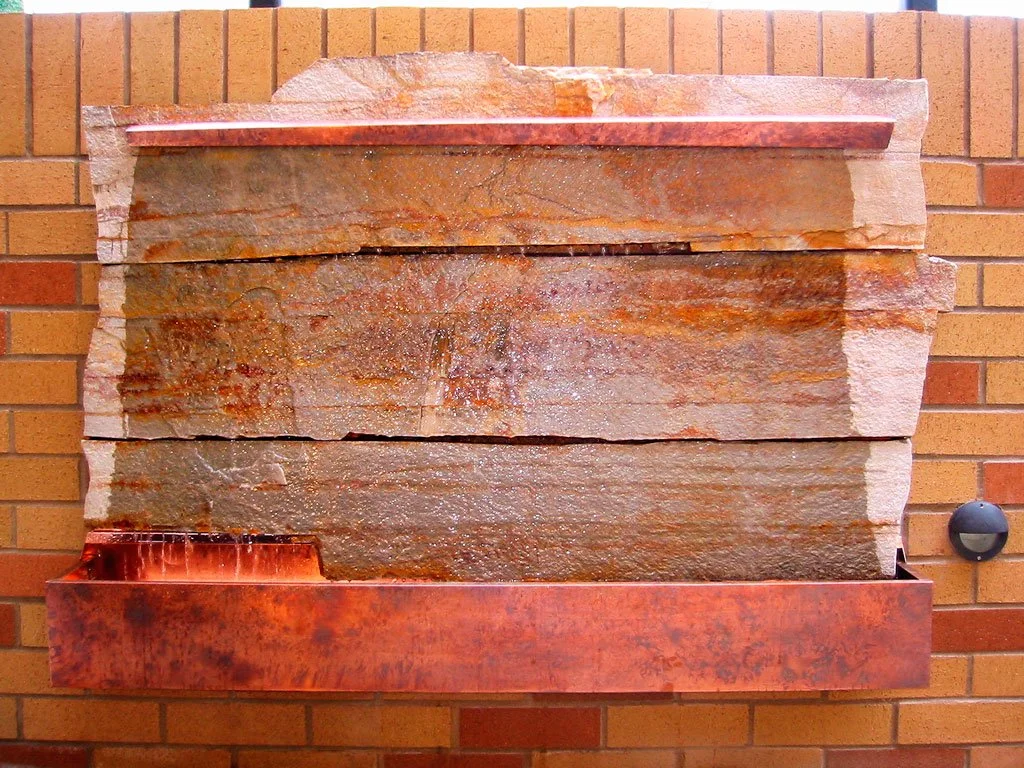 "Grace" water feature. Stone slabs and patinated copper. 40"h x 64"w x 8"d