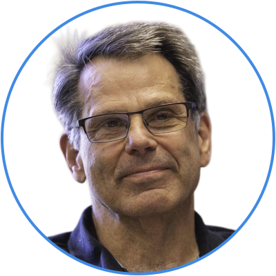 Close-up of a middle-aged man with glasses and gray hair, wearing a dark shirt, against a plain white background.