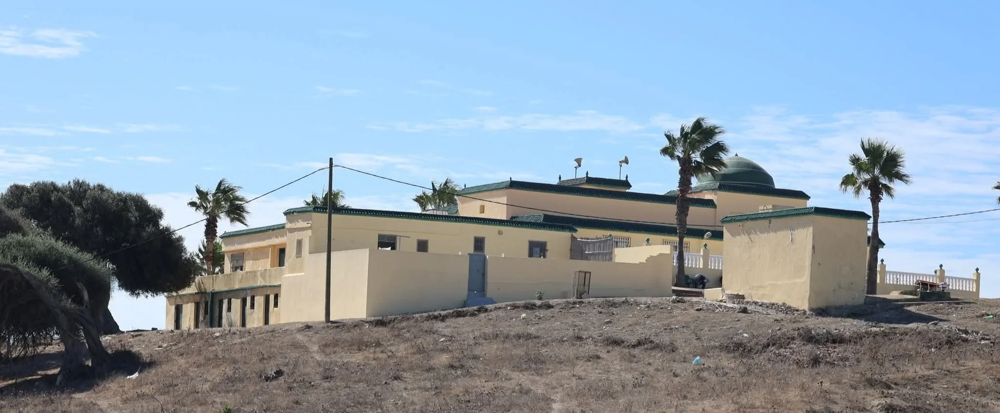 The shrine of al-Qāsim ibn Idrīs stands on a hill overlooking the Atlantic shoreline near Tangier.
