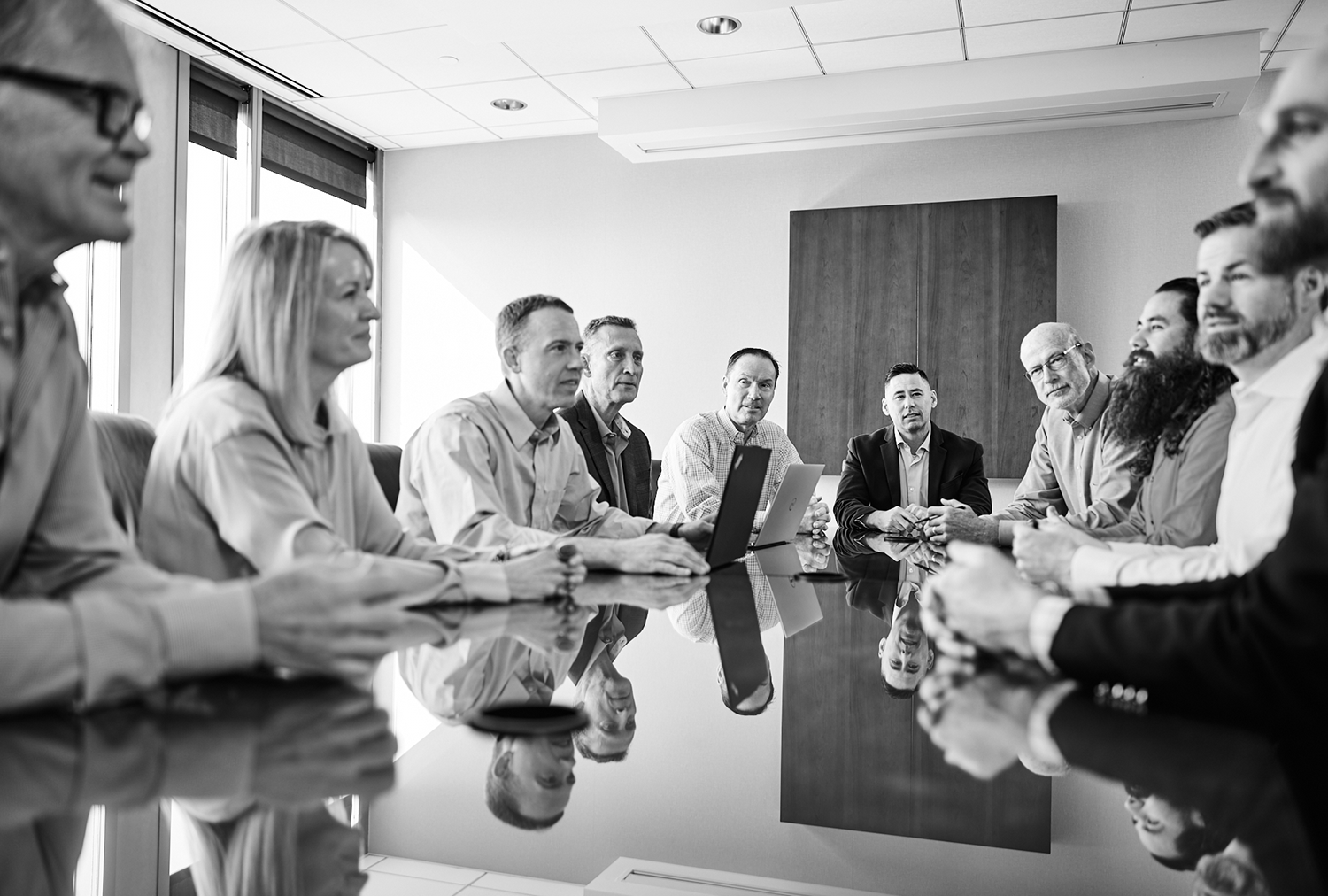 Lynk Engineers leadership team in a collaborative meeting — MEPT engineering firm serving Utah, Idaho, and Maryland