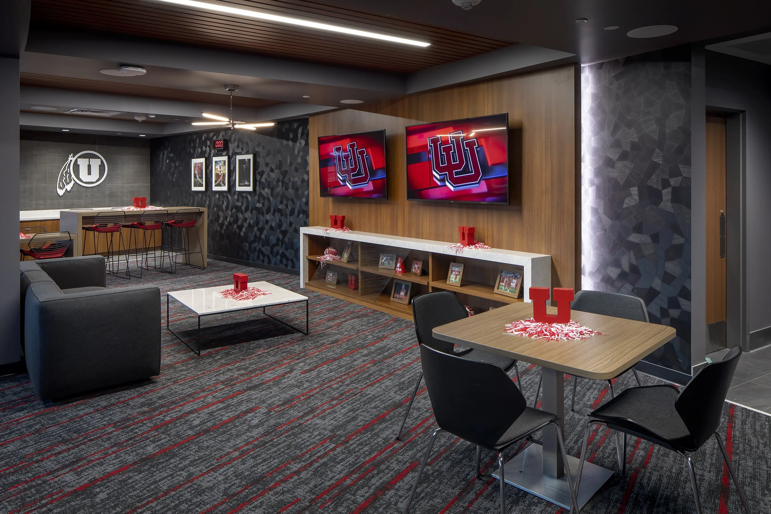Rice-Eccles Stadium team lounge interior — University of Utah sports venue MEP engineering by Lynk Engineers
