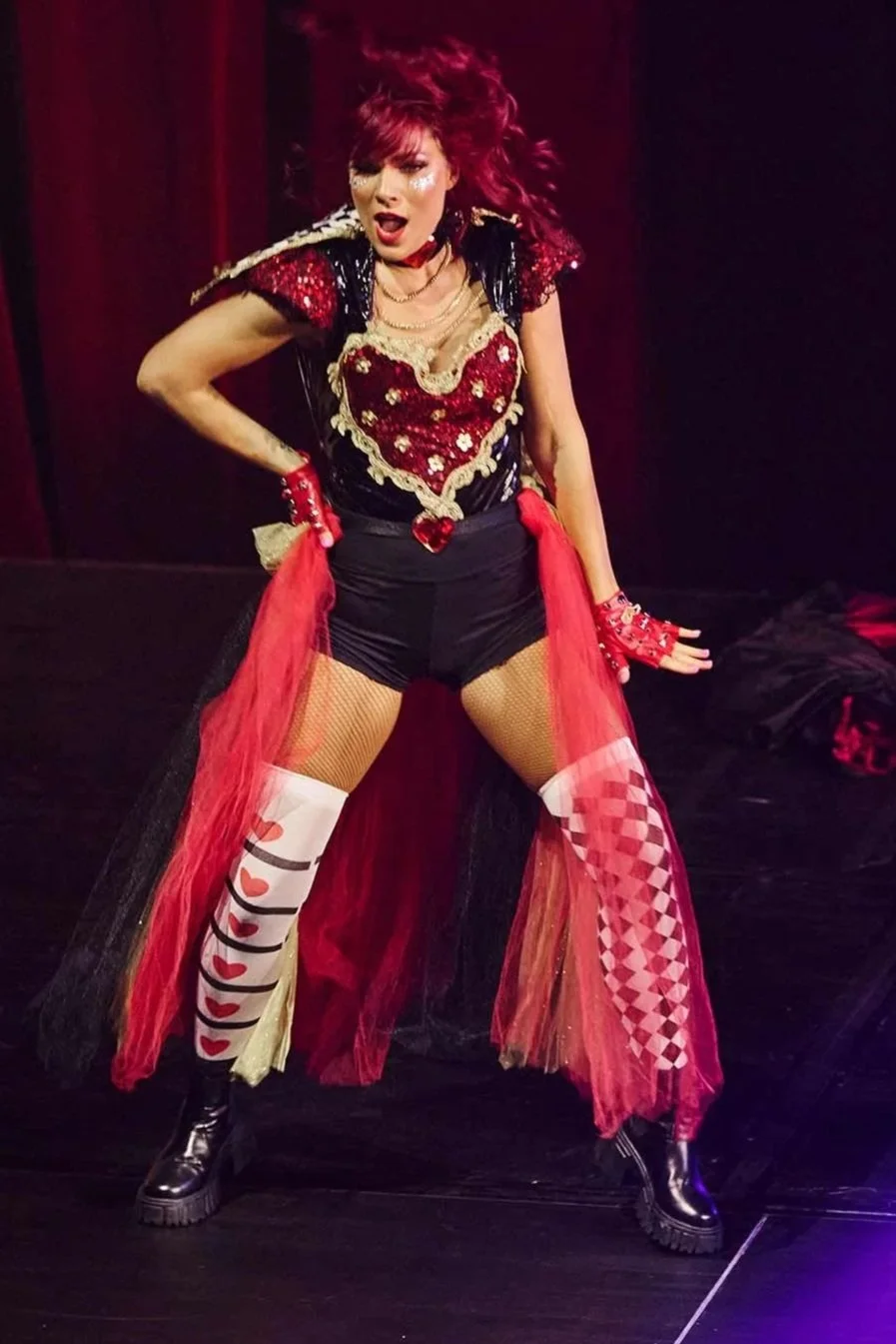 Lucy performing on stage as a professional dancer