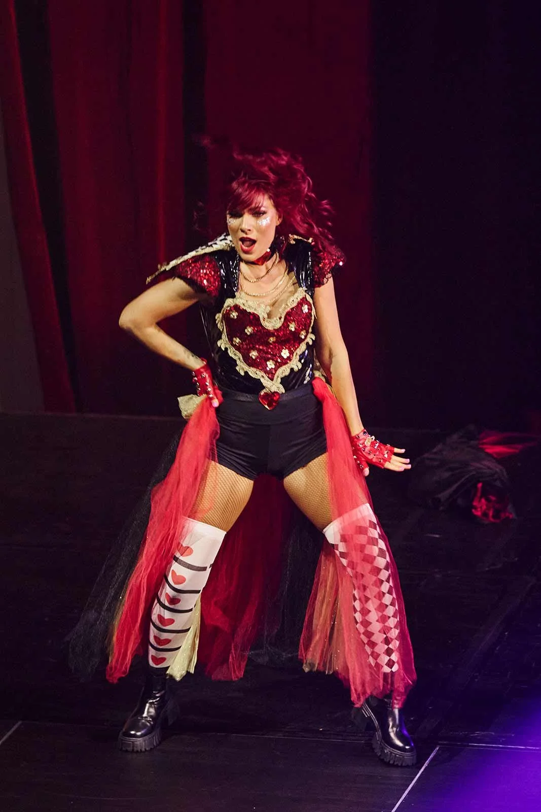 Lucy performing on stage as a professional dancer