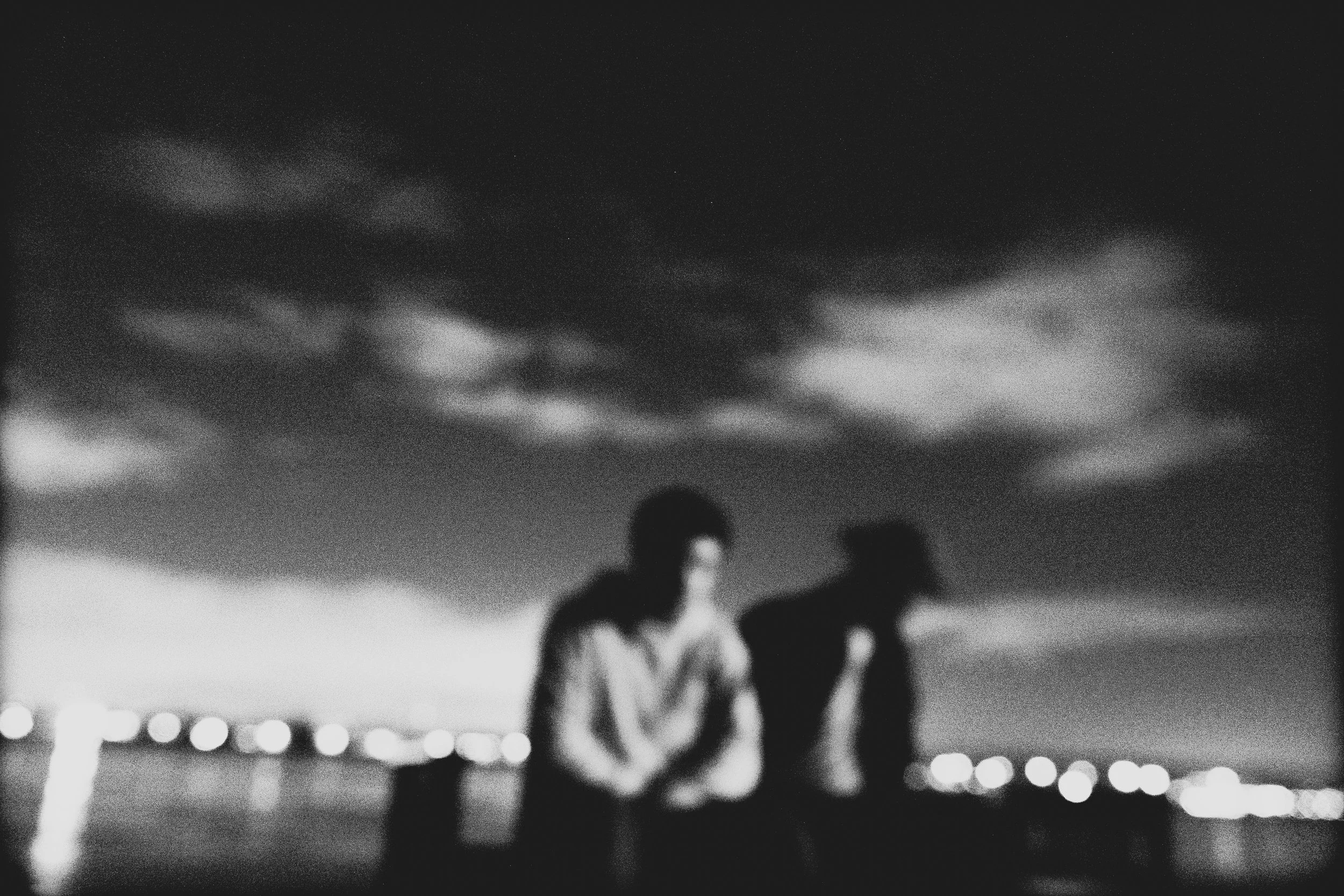 High-contrast candid flash photography of the EL Wedos band in Vancouver, WA. Unpolished style capturing authentic, unfiltered reality and personality against the dark, blooming PNW nature.