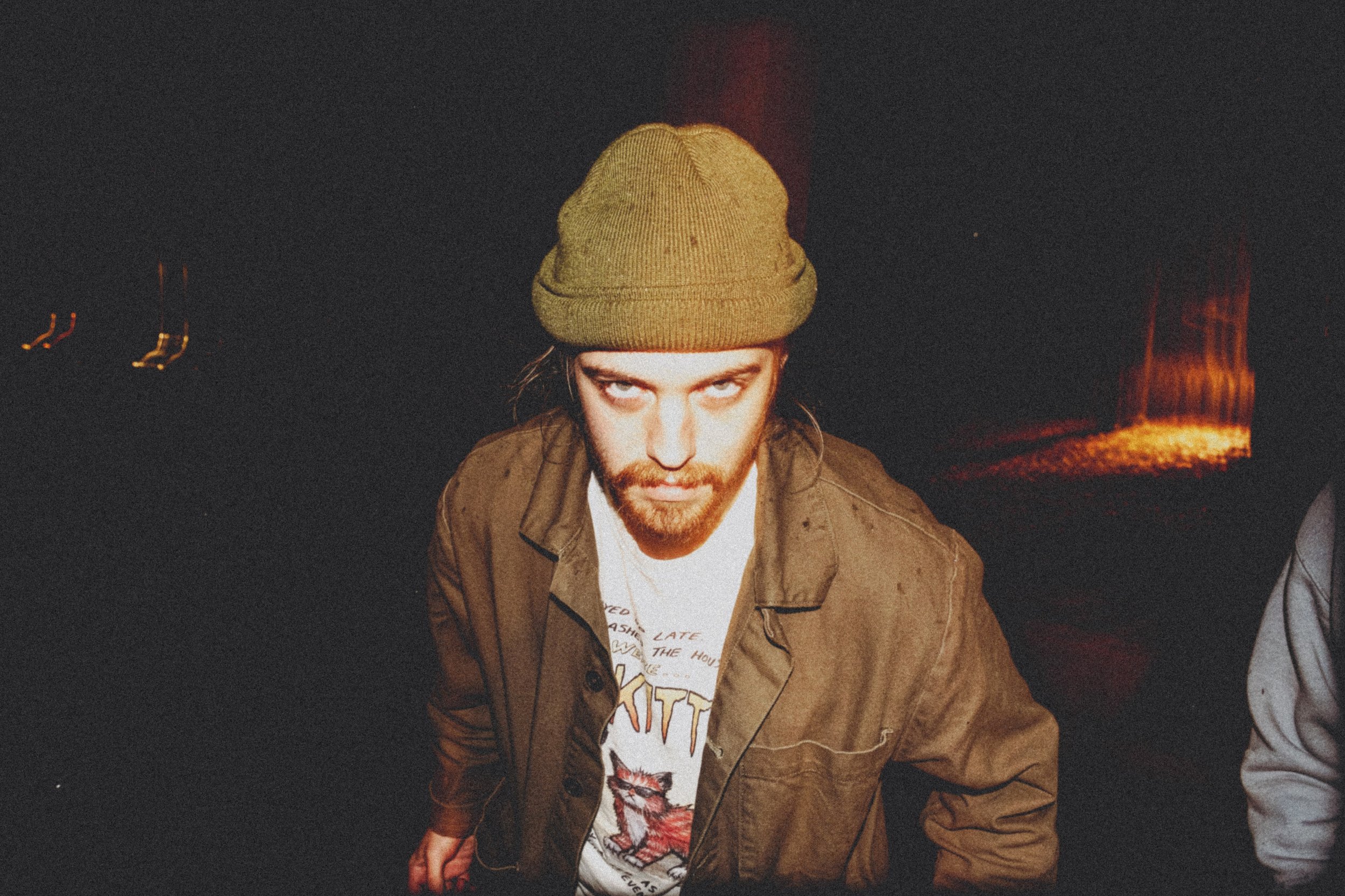 AJ Miranda Photography Candid, unpolished band photography from the Raw Reality series of EL Wedos, capturing genuine chaos using high-contrast dark flash in Vancouver, WA's deep PNW winter greens.