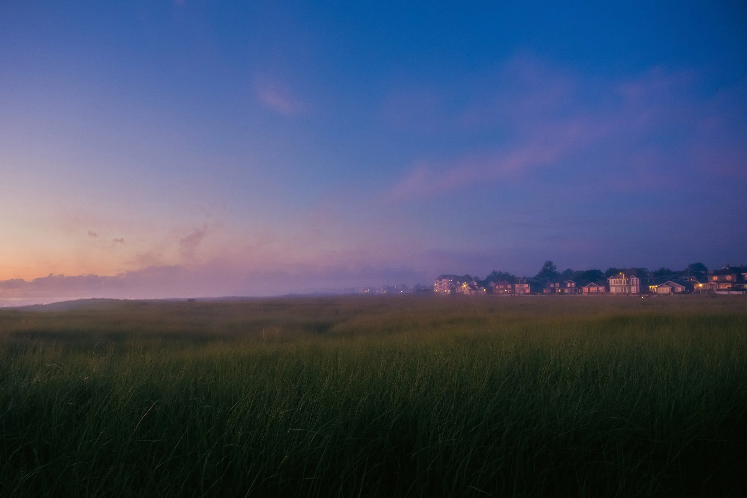 AJ Miranda Long-exposure, cinematic photographs documenting the intense 4th of July fireworks display and grand finale over Seaside, Oregon Coast in 2025. This dark and moody film series captures the chaotic, warzone-like atmosphere of the crowded be
