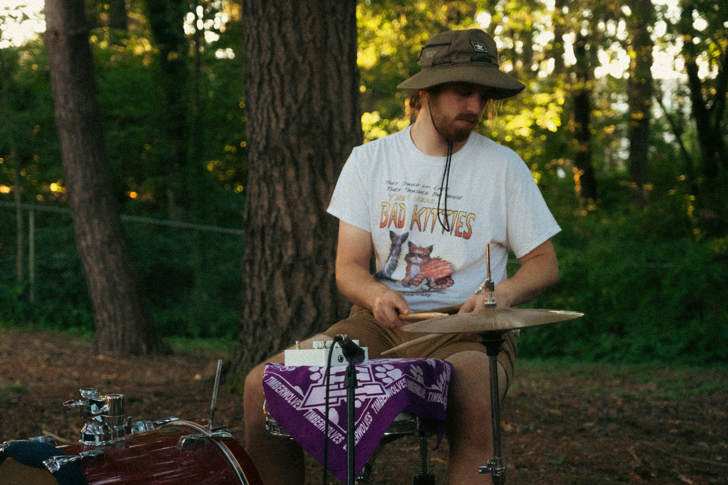 AJ Miranda Photography Candid, unpolished band photography from the Raw Reality series of EL Wedos, capturing genuine chaos using high-contrast dark flash in Vancouver, WA's deep PNW winter greens.