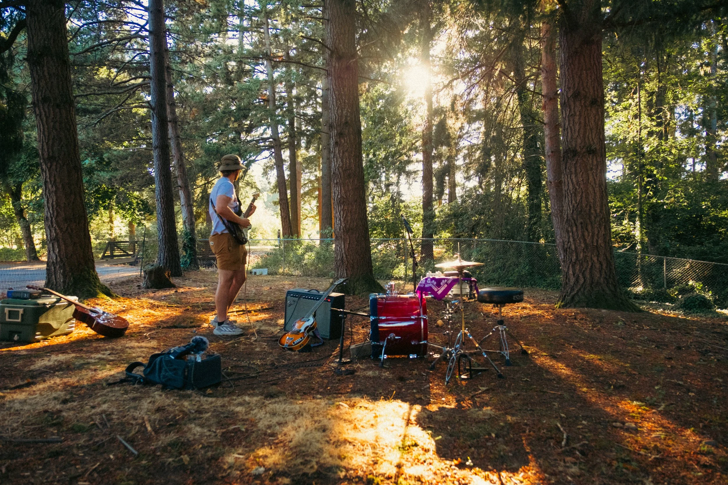 AJ Miranda Photography Candid, unpolished band photography from the Raw Reality series of EL Wedos, capturing genuine chaos using high-contrast dark flash in Vancouver, WA's deep PNW winter greens.