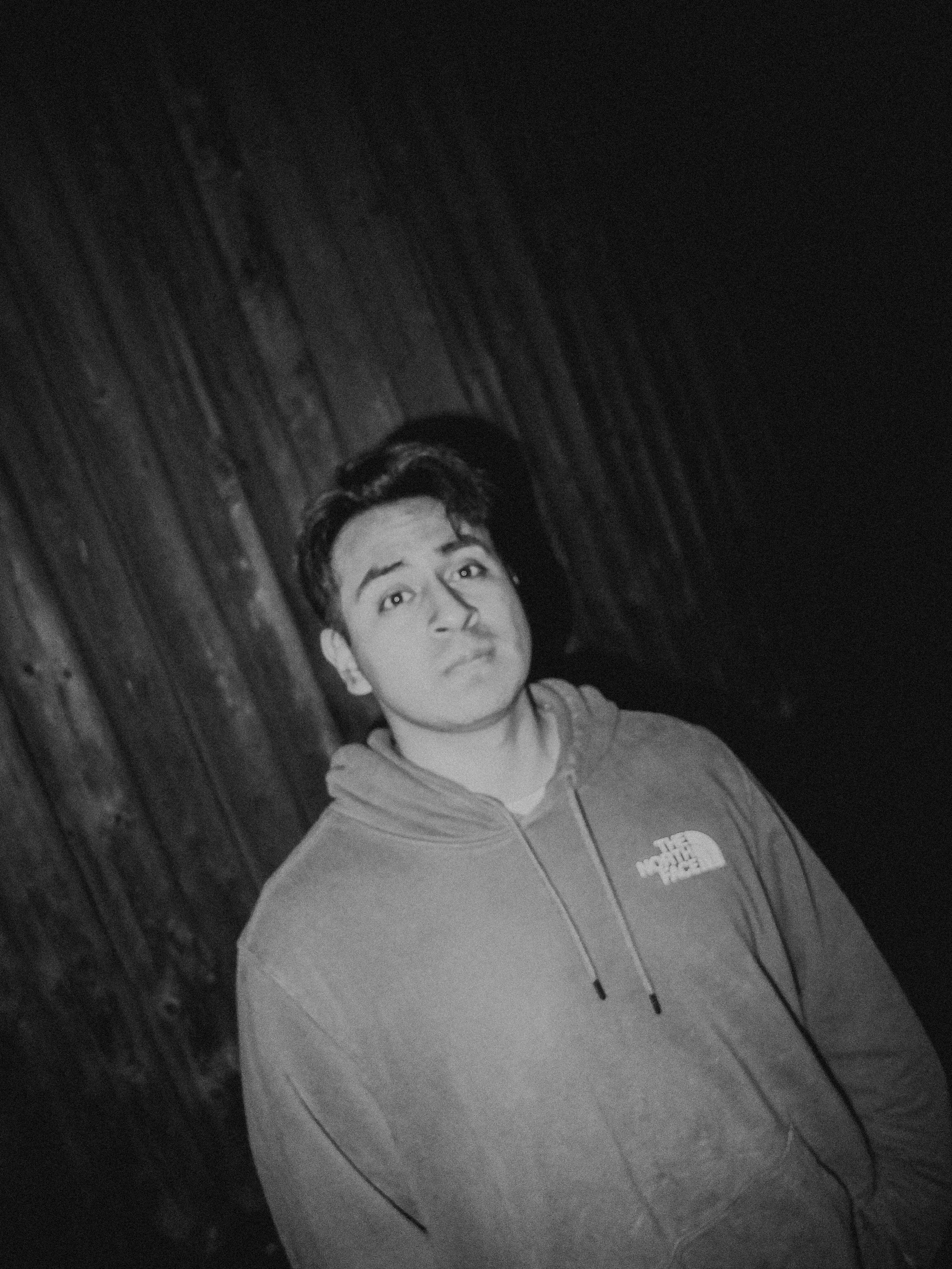 AJ Miranda Photography Candid, unpolished band photography from the Raw Reality series of EL Wedos, capturing genuine chaos using high-contrast dark flash in Vancouver, WA's deep PNW winter greens.