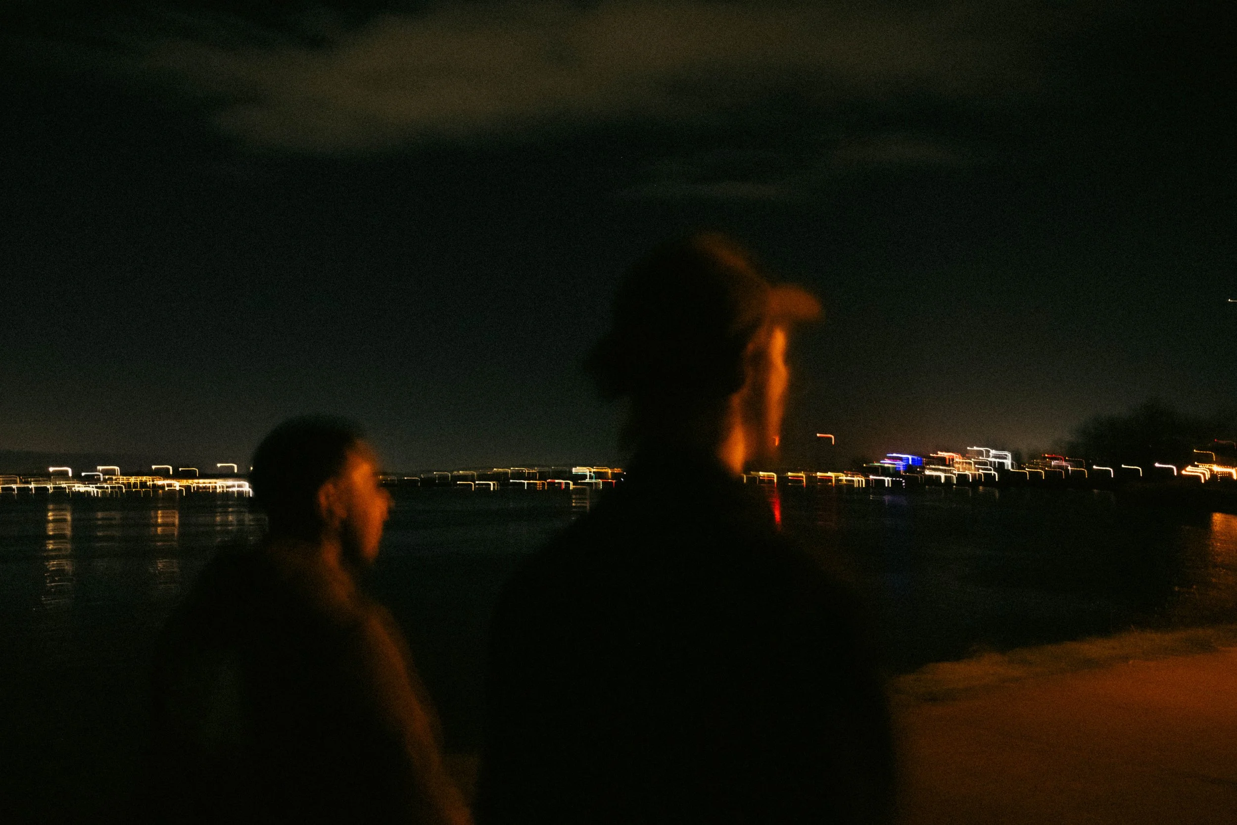 High-contrast candid flash photography of the EL Wedos band in Vancouver, WA. Unpolished style capturing authentic, unfiltered reality and personality against the dark, blooming PNW nature.