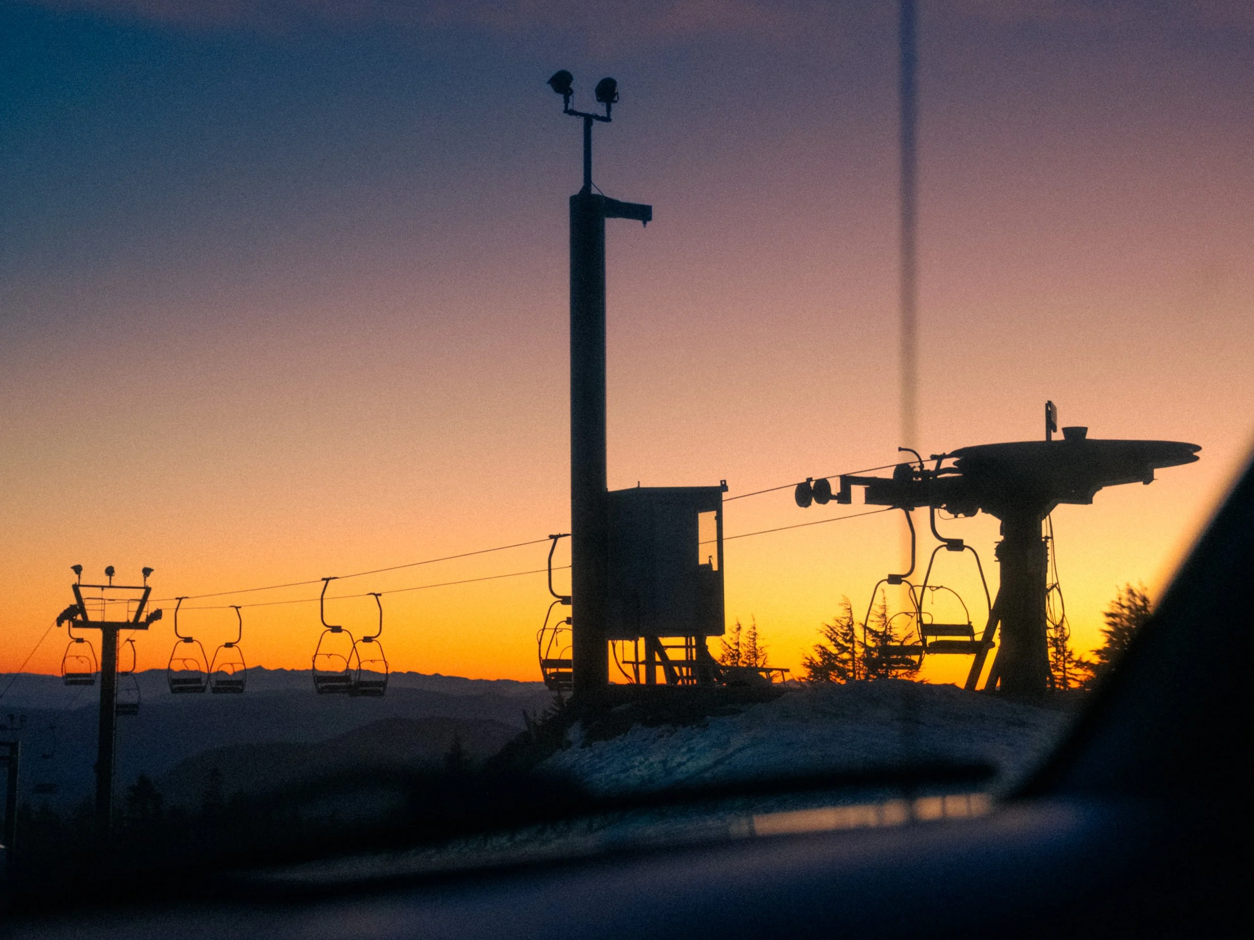 AJ Miranda Photography Vibrant PNW Alpine Photography capturing the snow-covered summit of Mt. Hood, Oregon, in October 2023, showcasing dramatic red and orange lighting.