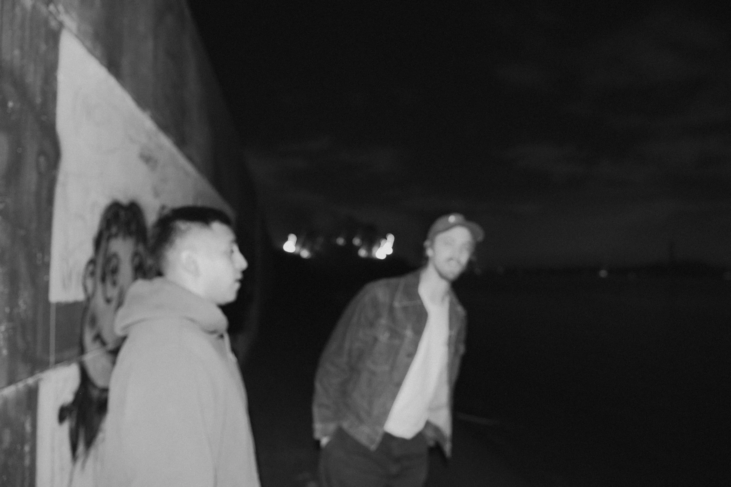 High-contrast candid flash photography of the EL Wedos band in Vancouver, WA. Unpolished style capturing authentic, unfiltered reality and personality against the dark, blooming PNW nature.