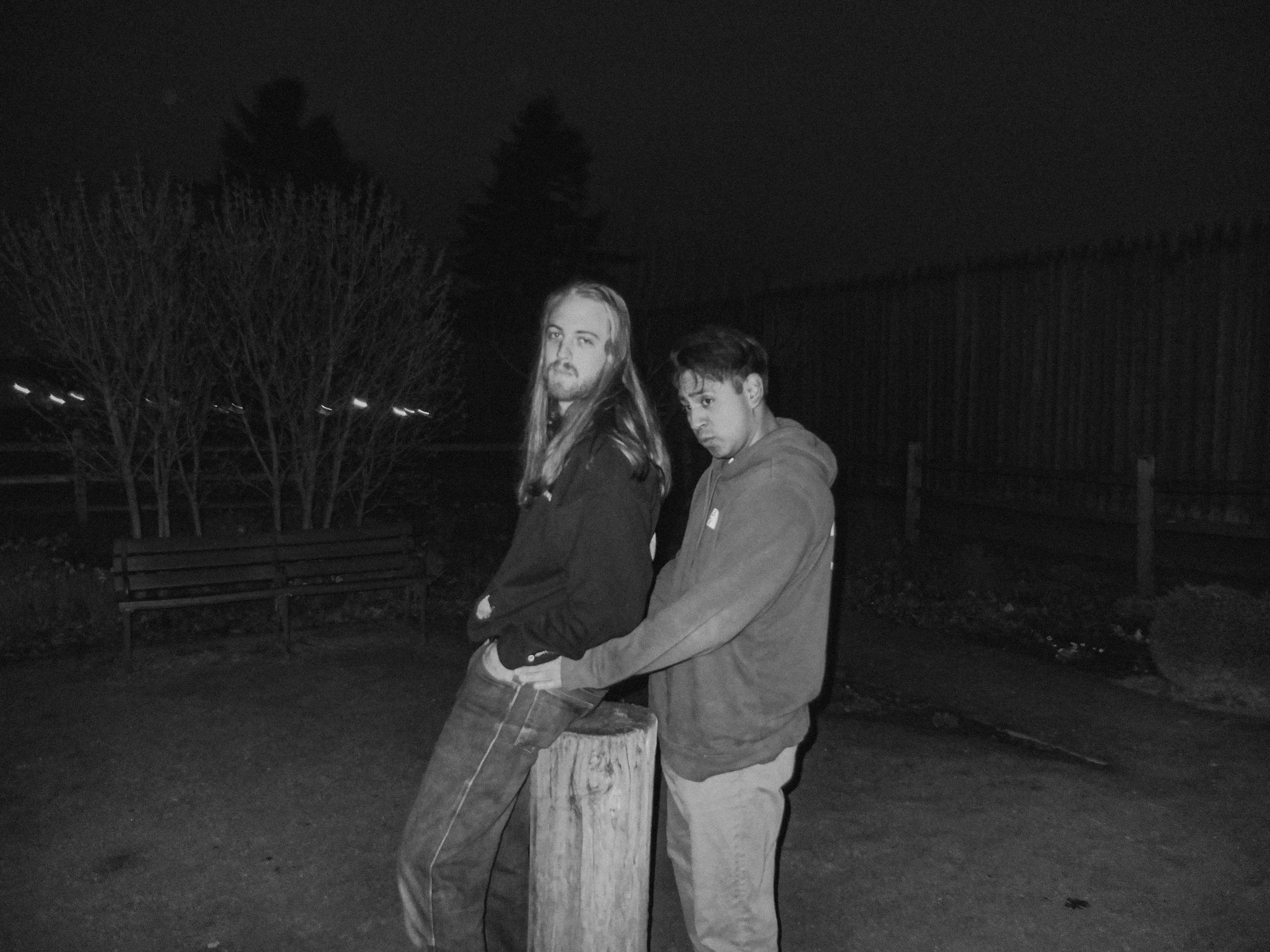 AJ Miranda Photography Candid, unpolished band photography from the Raw Reality series of EL Wedos, capturing genuine chaos using high-contrast dark flash in Vancouver, WA's deep PNW winter greens.