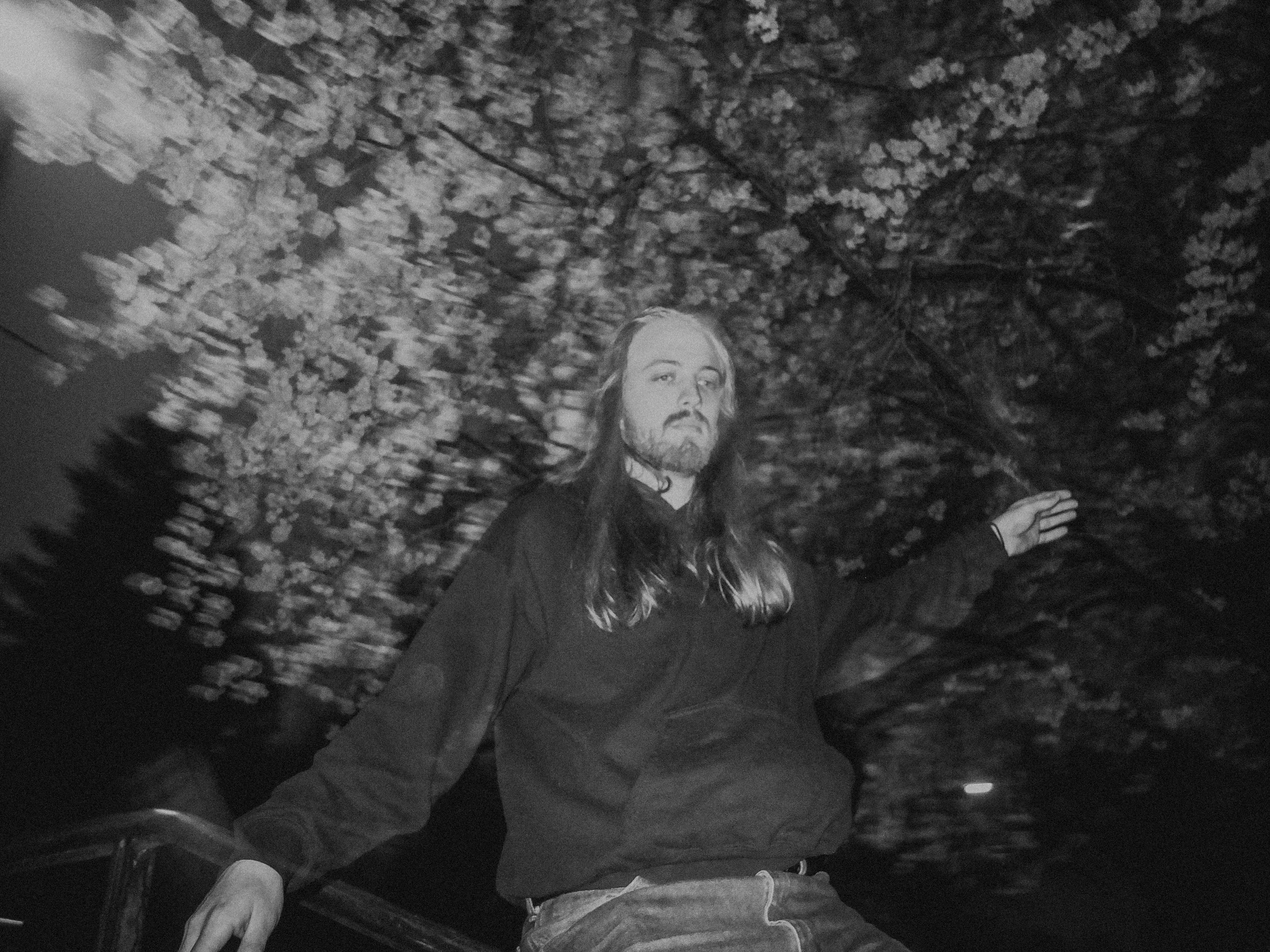 AJ Miranda Photography Candid, unpolished band photography from the Raw Reality series of EL Wedos, capturing genuine chaos using high-contrast dark flash in Vancouver, WA's deep PNW winter greens.