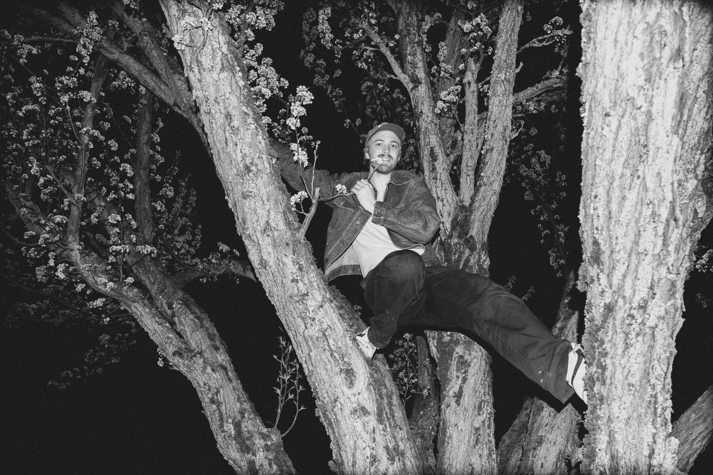 High-contrast candid flash photography of the EL Wedos band in Vancouver, WA. Unpolished style capturing authentic, unfiltered reality and personality against the dark, blooming PNW nature.