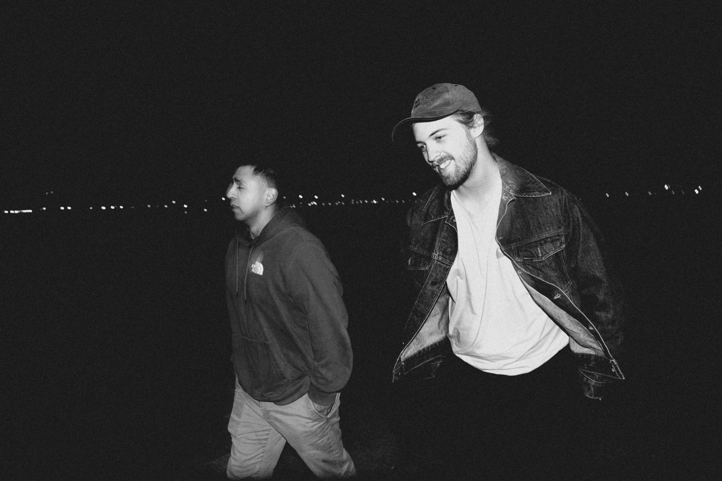 High-contrast candid flash photography of the EL Wedos band in Vancouver, WA. Unpolished style capturing authentic, unfiltered reality and personality against the dark, blooming PNW nature.