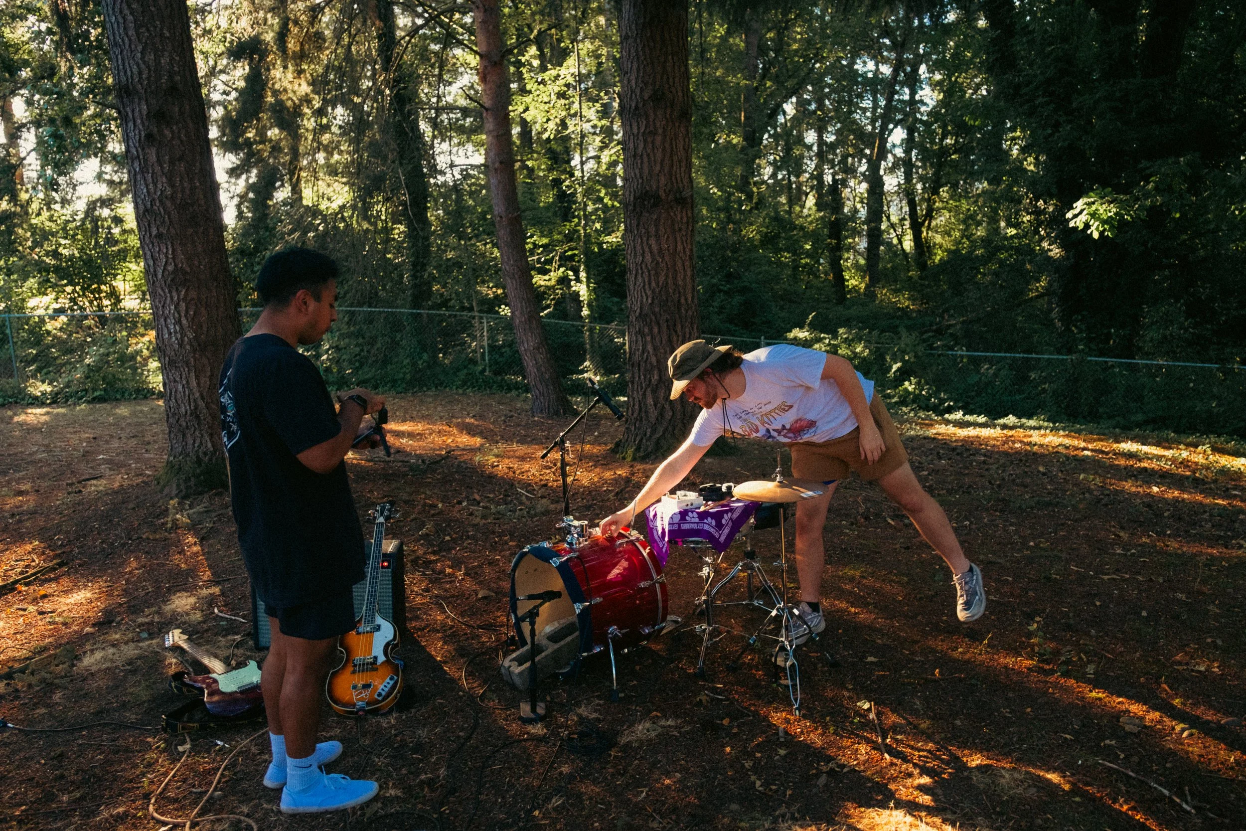 AJ Miranda Photography Candid, unpolished band photography from the Raw Reality series of EL Wedos, capturing genuine chaos using high-contrast dark flash in Vancouver, WA's deep PNW winter greens.
