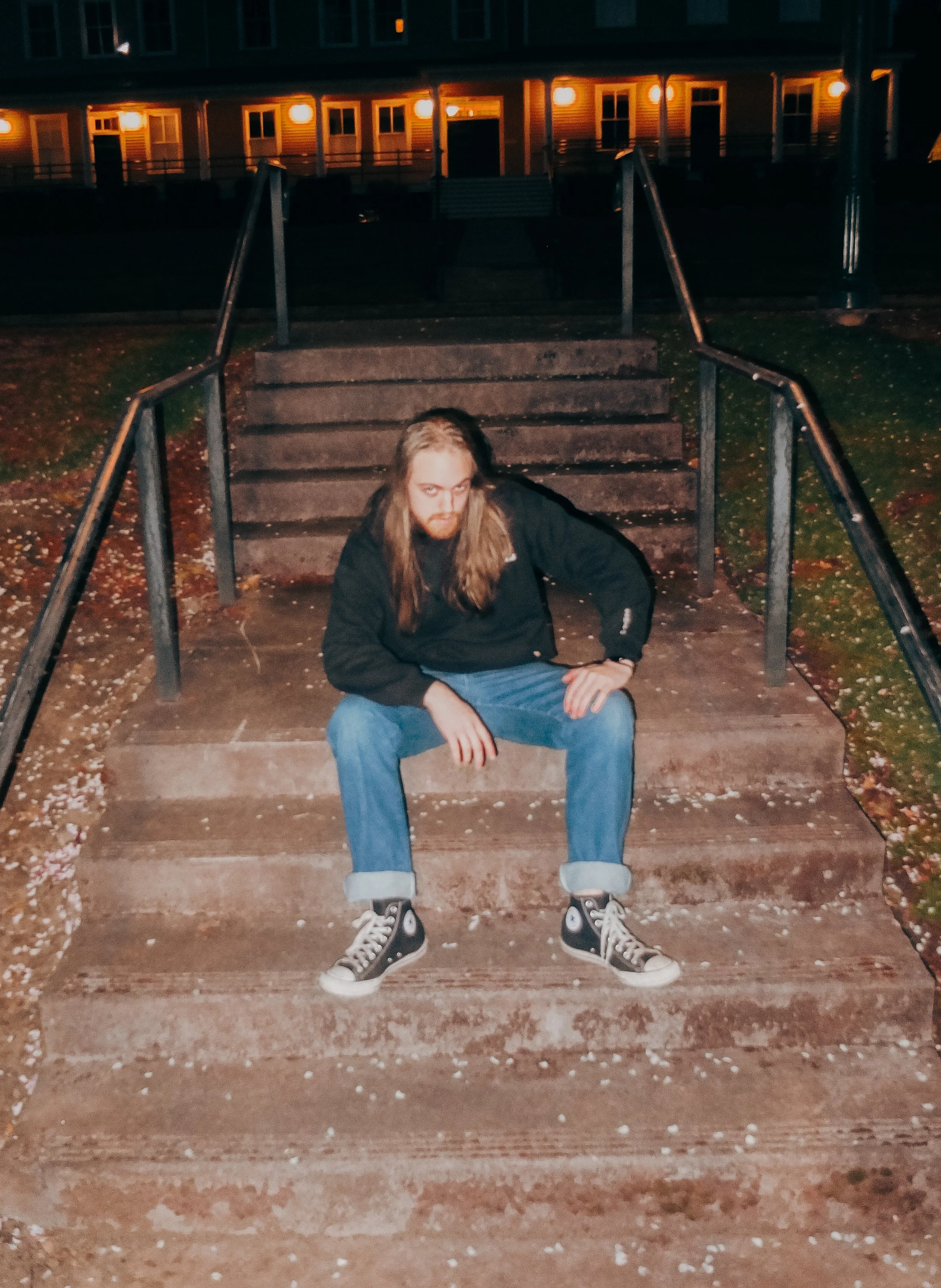 AJ Miranda Photography Candid, unpolished band photography from the Raw Reality series of EL Wedos, capturing genuine chaos using high-contrast dark flash in Vancouver, WA's deep PNW winter greens.