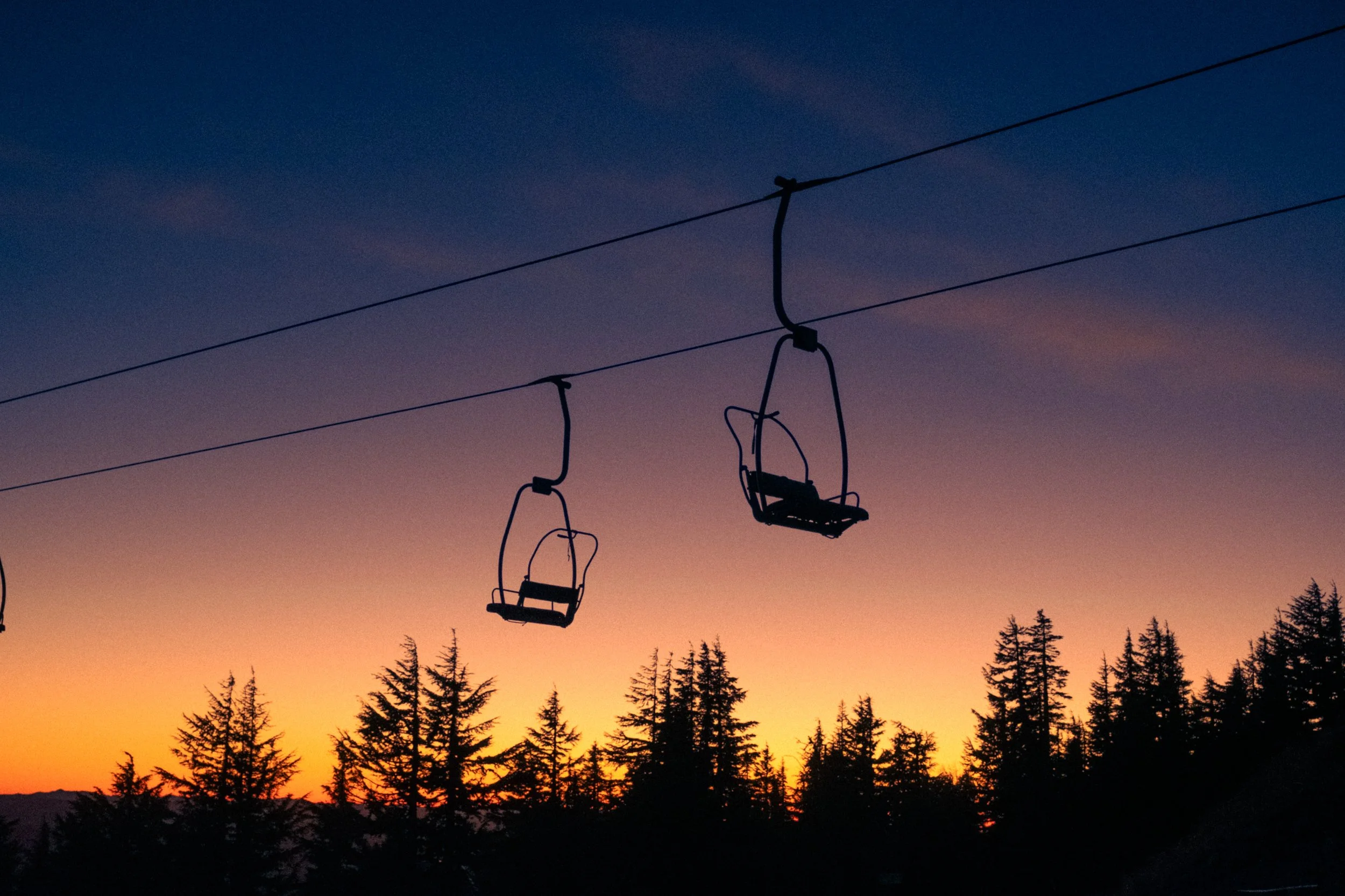 AJ Miranda Photography Vibrant PNW Alpine Photography capturing the snow-covered summit of Mt. Hood, Oregon, in October 2023, showcasing dramatic red and orange lighting.