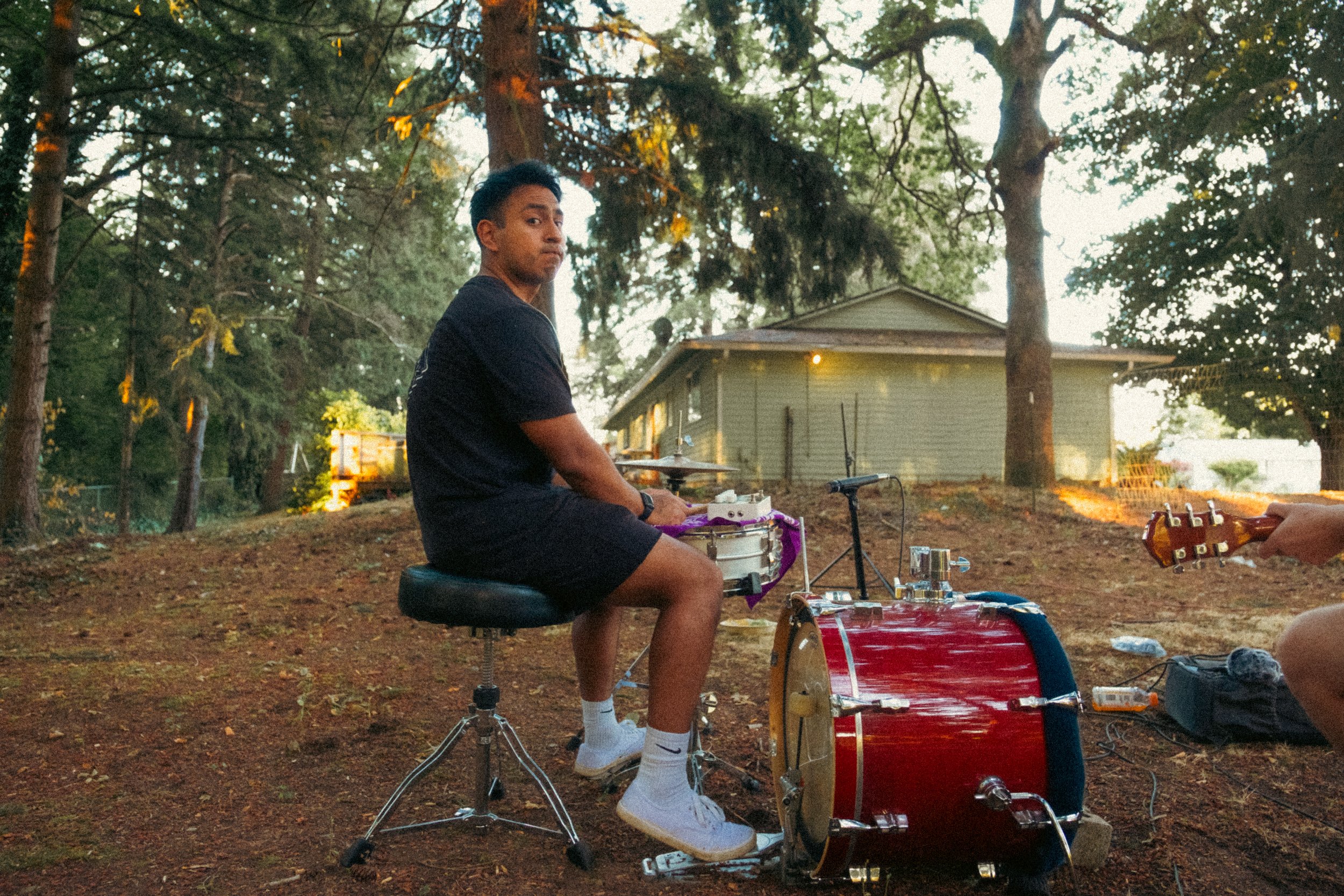 Unpolished band portrait from the Raw Reality series of EL Wedos, emphasizing the high-contrast flash lighting against the deep, irresistible PNW winter and spring greens in Vancouver, WA.
