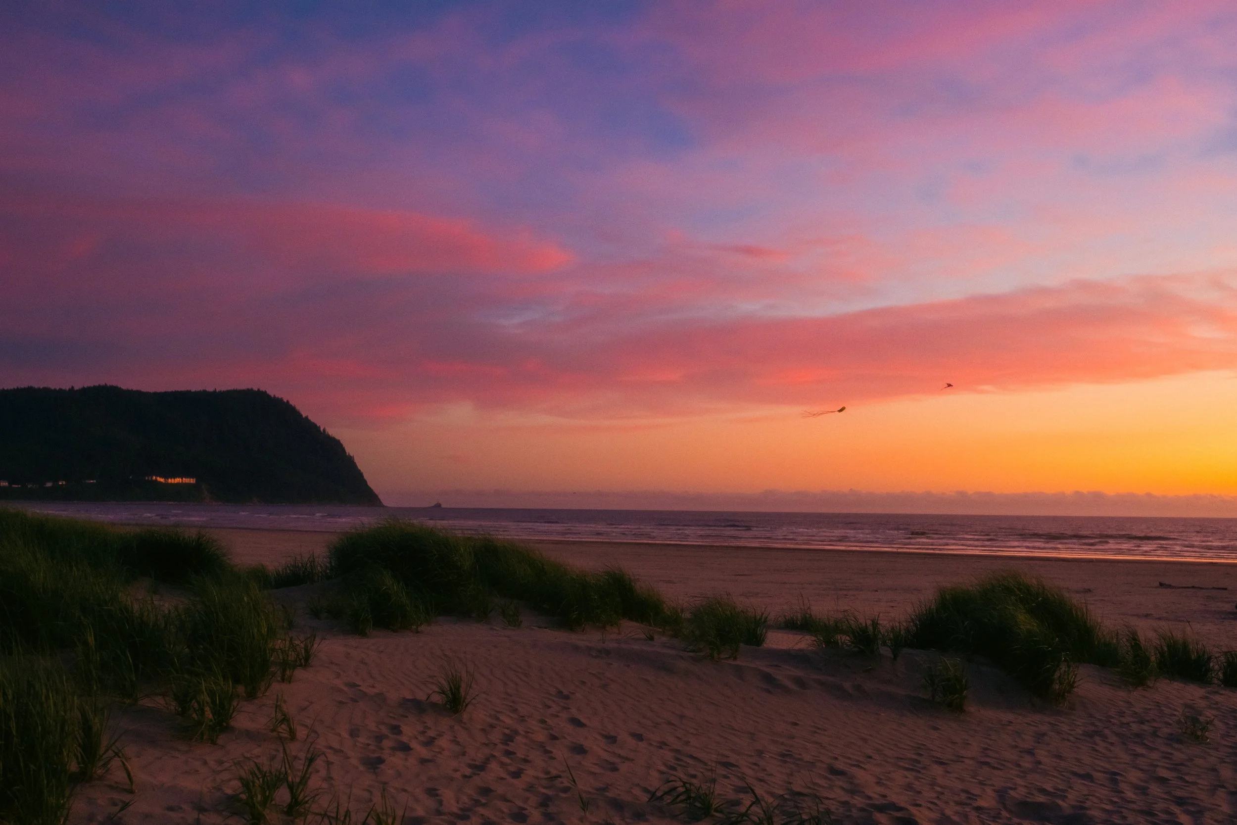 AJ Miranda Long-exposure, cinematic photographs documenting the intense 4th of July fireworks display and grand finale over Seaside, Oregon Coast in 2025. This dark and moody film series captures the chaotic, warzone-like atmosphere of the crowded be