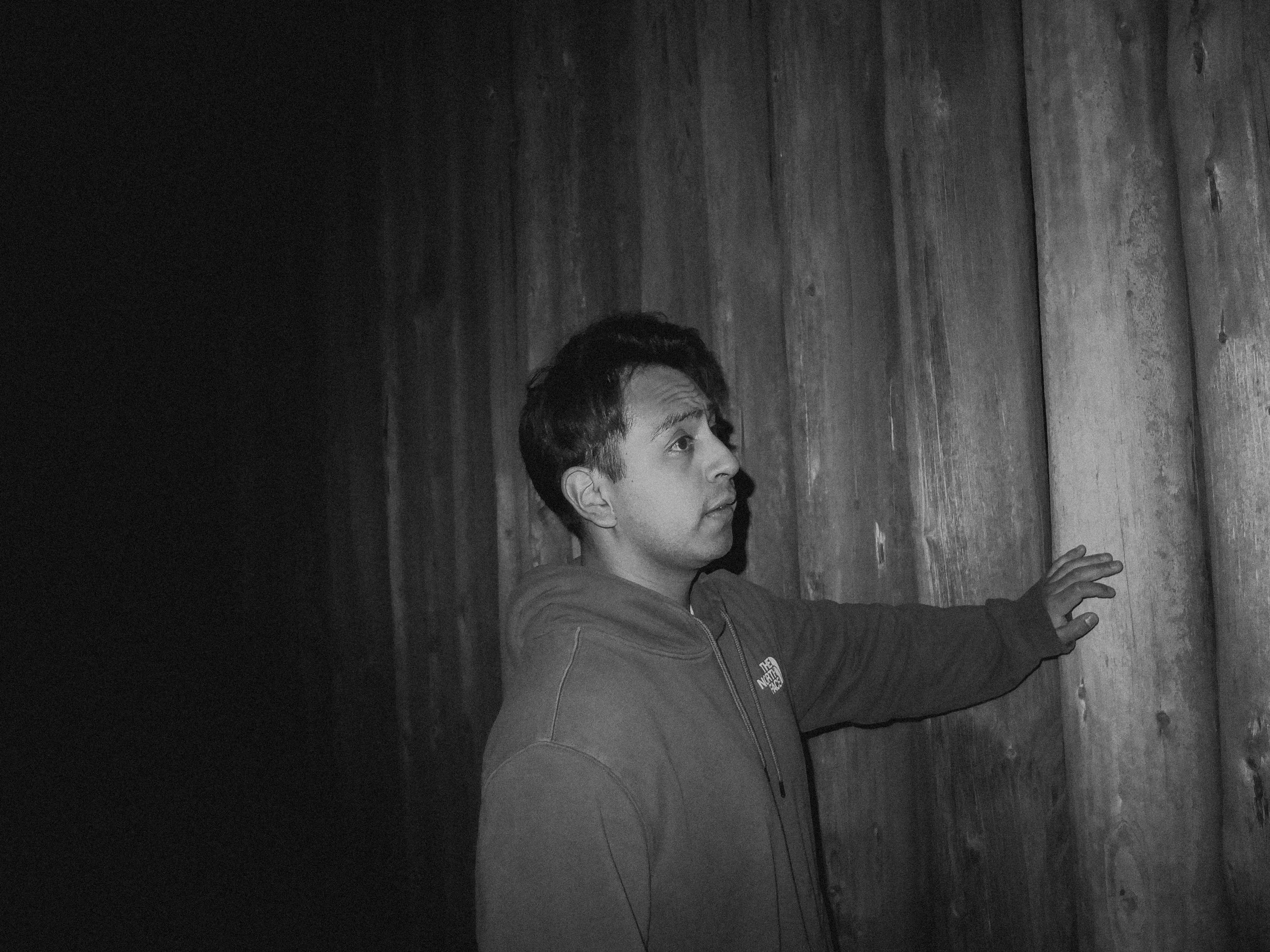 AJ Miranda Photography Candid, unpolished band photography from the Raw Reality series of EL Wedos, capturing genuine chaos using high-contrast dark flash in Vancouver, WA's deep PNW winter greens.