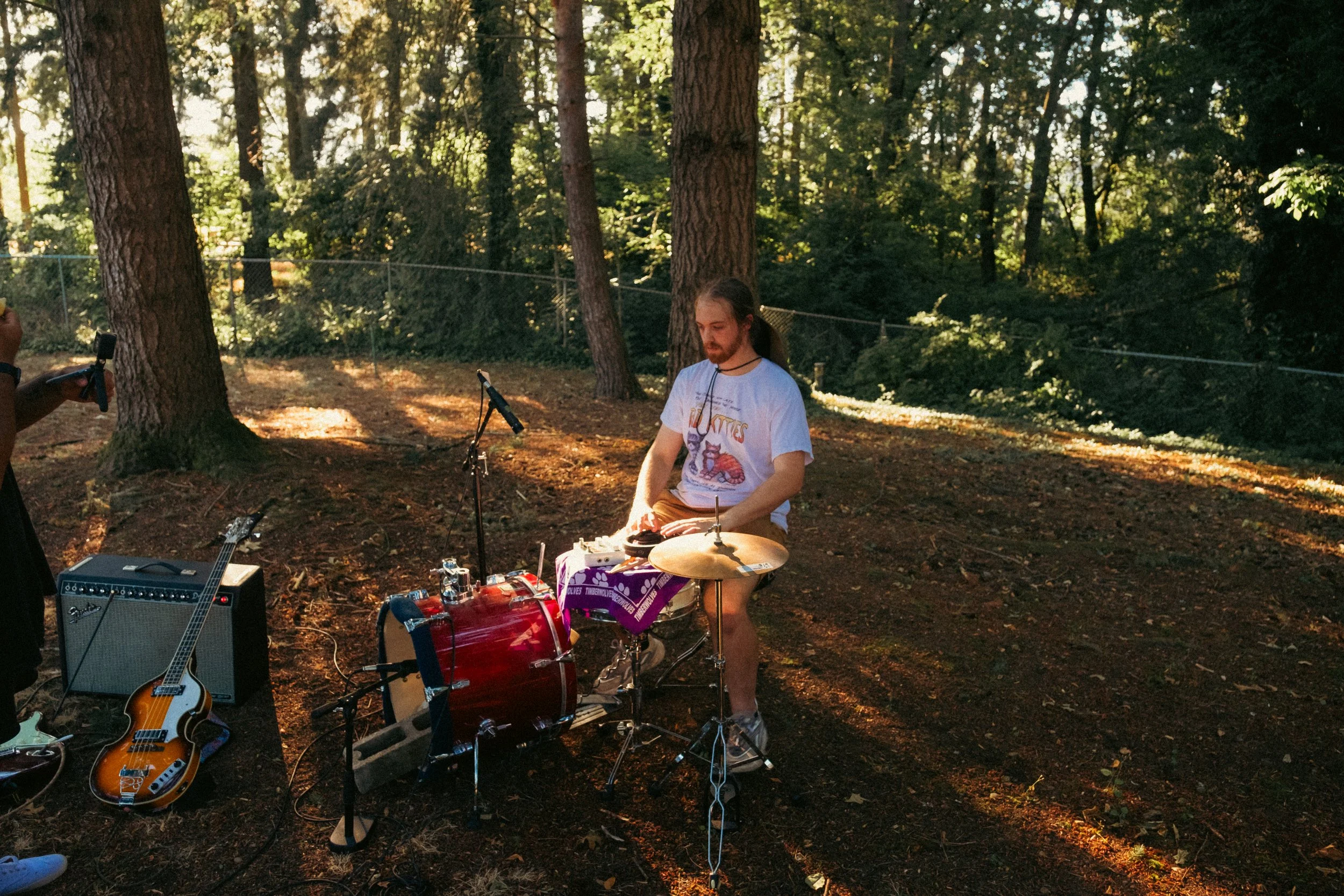 AJ Miranda Photography Candid, unpolished band photography from the Raw Reality series of EL Wedos, capturing genuine chaos using high-contrast dark flash in Vancouver, WA's deep PNW winter greens.