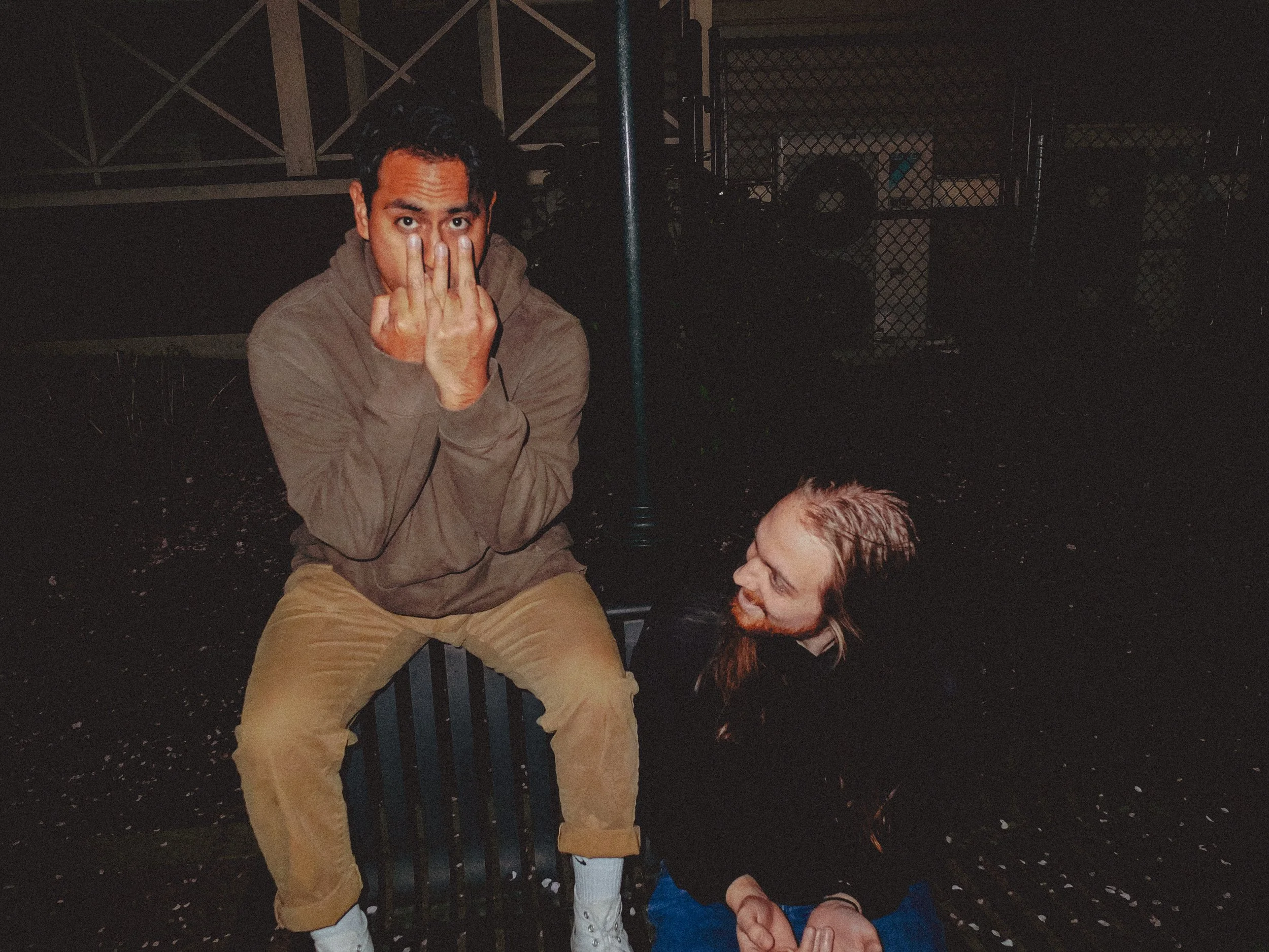 AJ Miranda Photography Candid, unpolished band photography from the Raw Reality series of EL Wedos, capturing genuine chaos using high-contrast dark flash in Vancouver, WA's deep PNW winter greens.