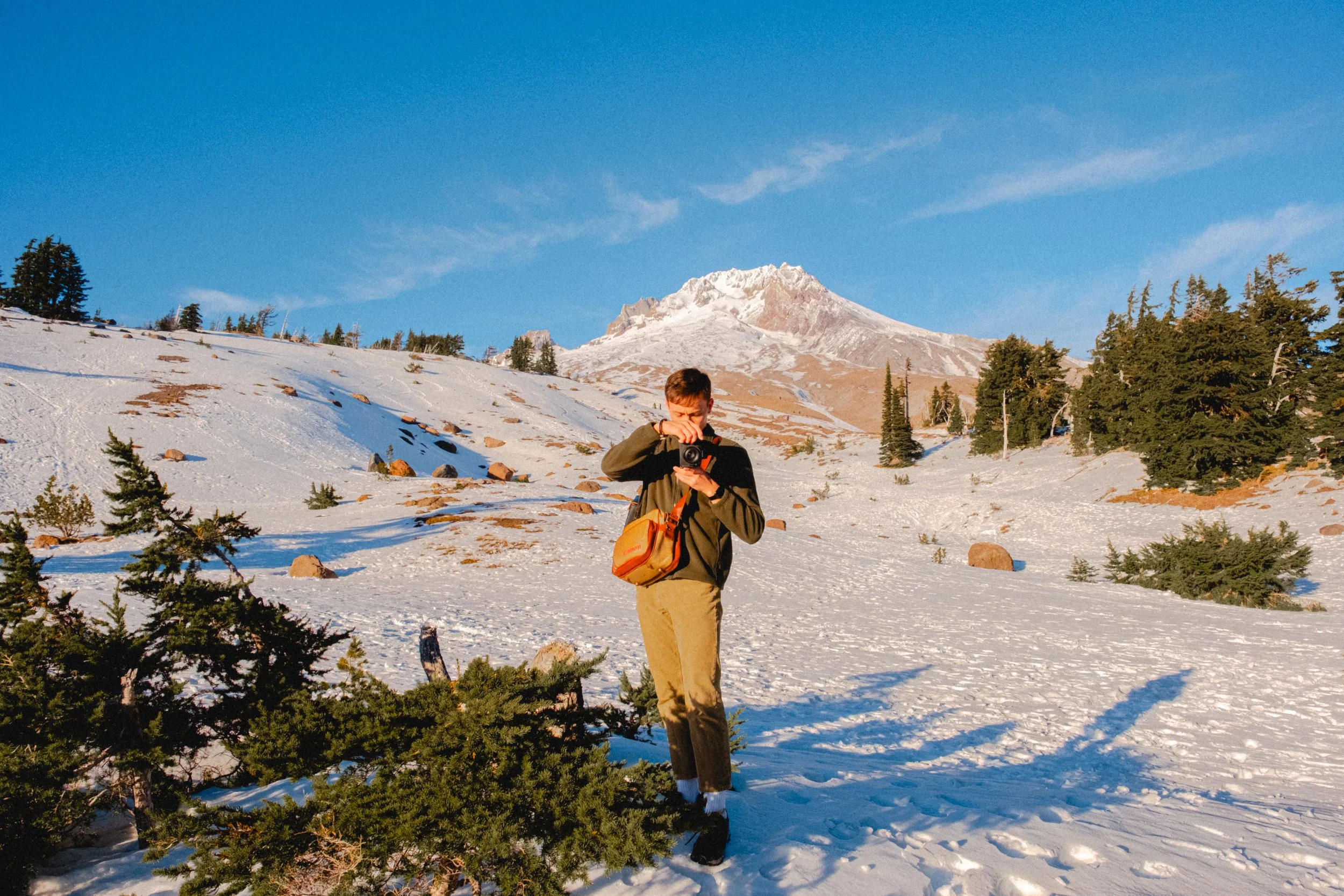 AJ Miranda Photography Vibrant PNW Alpine Photography capturing the snow-covered summit of Mt. Hood, Oregon, in October 2023, showcasing dramatic red and orange lighting.