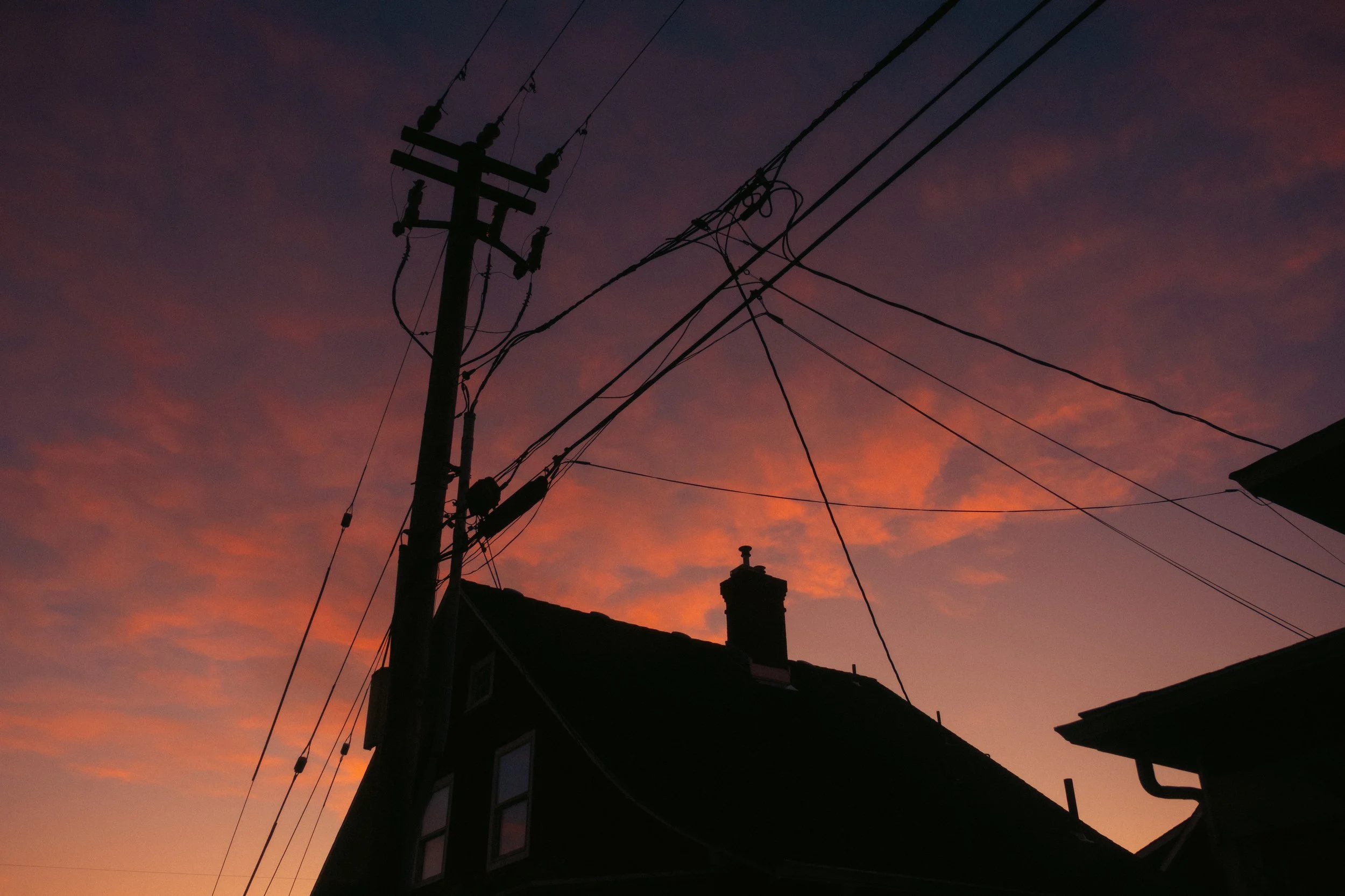 AJ Miranda Long-exposure, cinematic photographs documenting the intense 4th of July fireworks display and grand finale over Seaside, Oregon Coast in 2025. This dark and moody film series captures the chaotic, warzone-like atmosphere of the crowded be