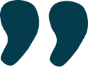 Two large quotation marks in dark color on a white background.