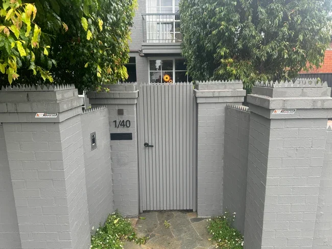 Anti-climb toppers fitted along a Melbourne boundary fence