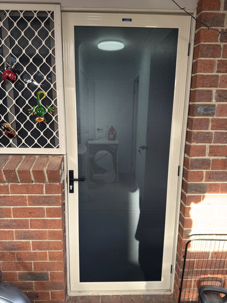 Security screen door fitted to a residential front entrance