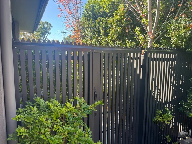 Steel anti-climb topper run along a rear fence line